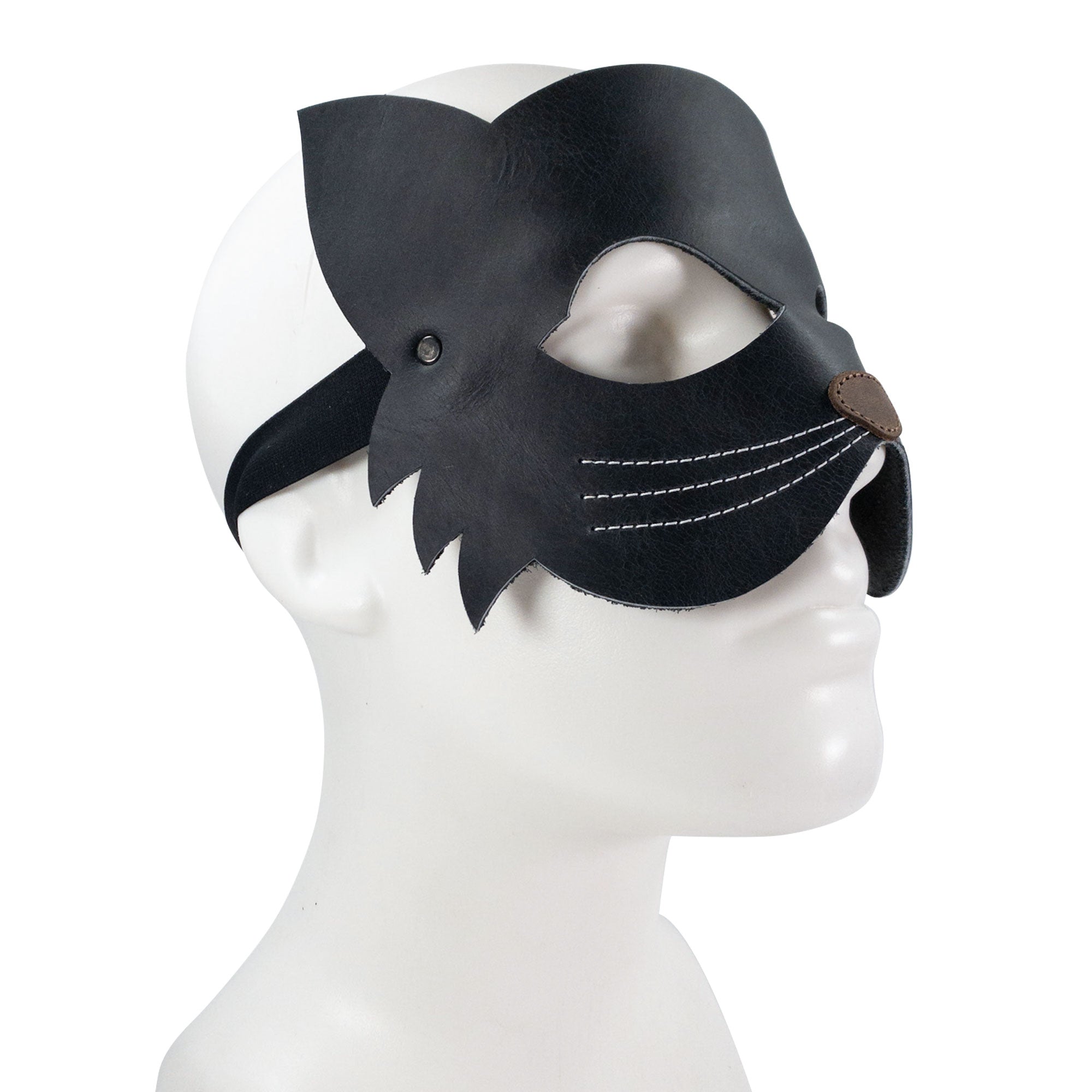 Side view of the Cat Shape Face Mask by Hide & Play, showcasing its intricate design made from full grain leather. This custom accessory is perfect for costume events, reflecting the artisan craftsmanship of La Antigua Guatemala. Each mask is a testament to small batch production, hand-cut and hand-sewn for quality.