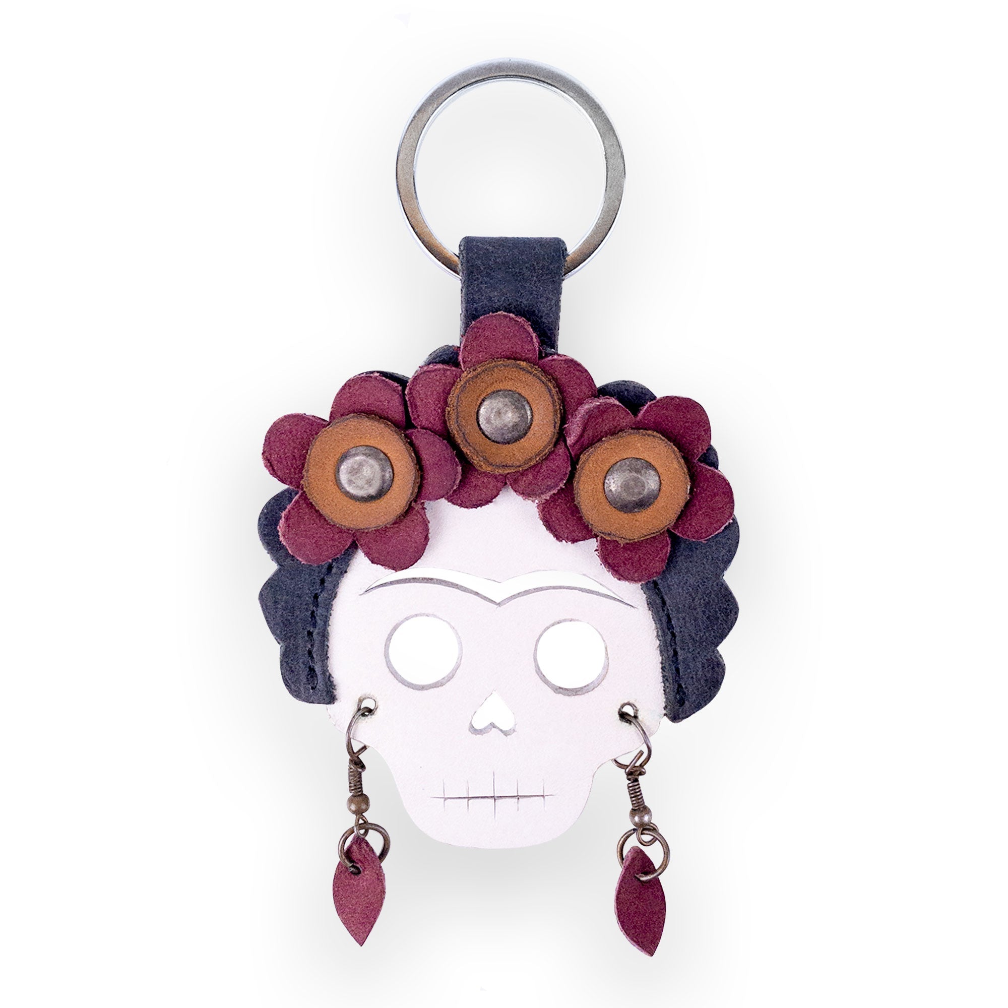 The Lady Skull Leather Keychain by Hide & Drink featuring detailed craftsmanship and vibrant flowers, making it a perfect keyring or key organizer. Emphasizing Day Of The Dead traditions, this artisan piece blends Full Grain Leather with Mexican culture, hand cut and sewn in La Antigua Guatemala and Oaxaca Mexico.