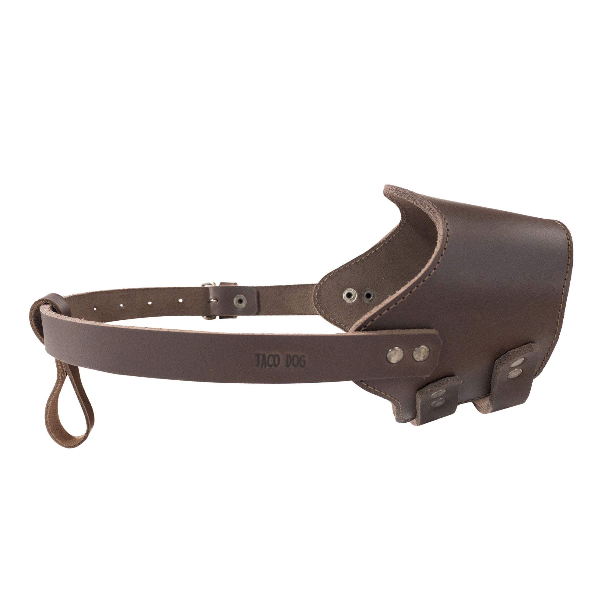 A top-down perspective of the Adjustable Dog Muzzle by Taco Dog, showcasing its sleek design and durable construction. Made in La Antigua Guatemala, this full grain leather muzzle offers artisan quality for your pet.