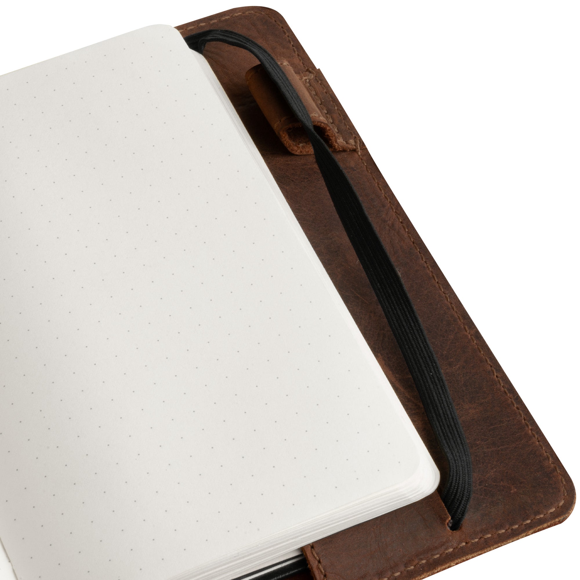 Close-up of the interior of Leuchtturm A6 Hardcover Case by Hide & Drink, highlighting the smooth leather and notepad, suitable as a Leather A6 Notebook Cover for Leuchtturm 3.6 x 5.9 in. This is an excellent refillable mini planner case and travel journal cover for men; works well with Moleskine & Hobonichi, and serves as a travelers pocket portfolio binder.
