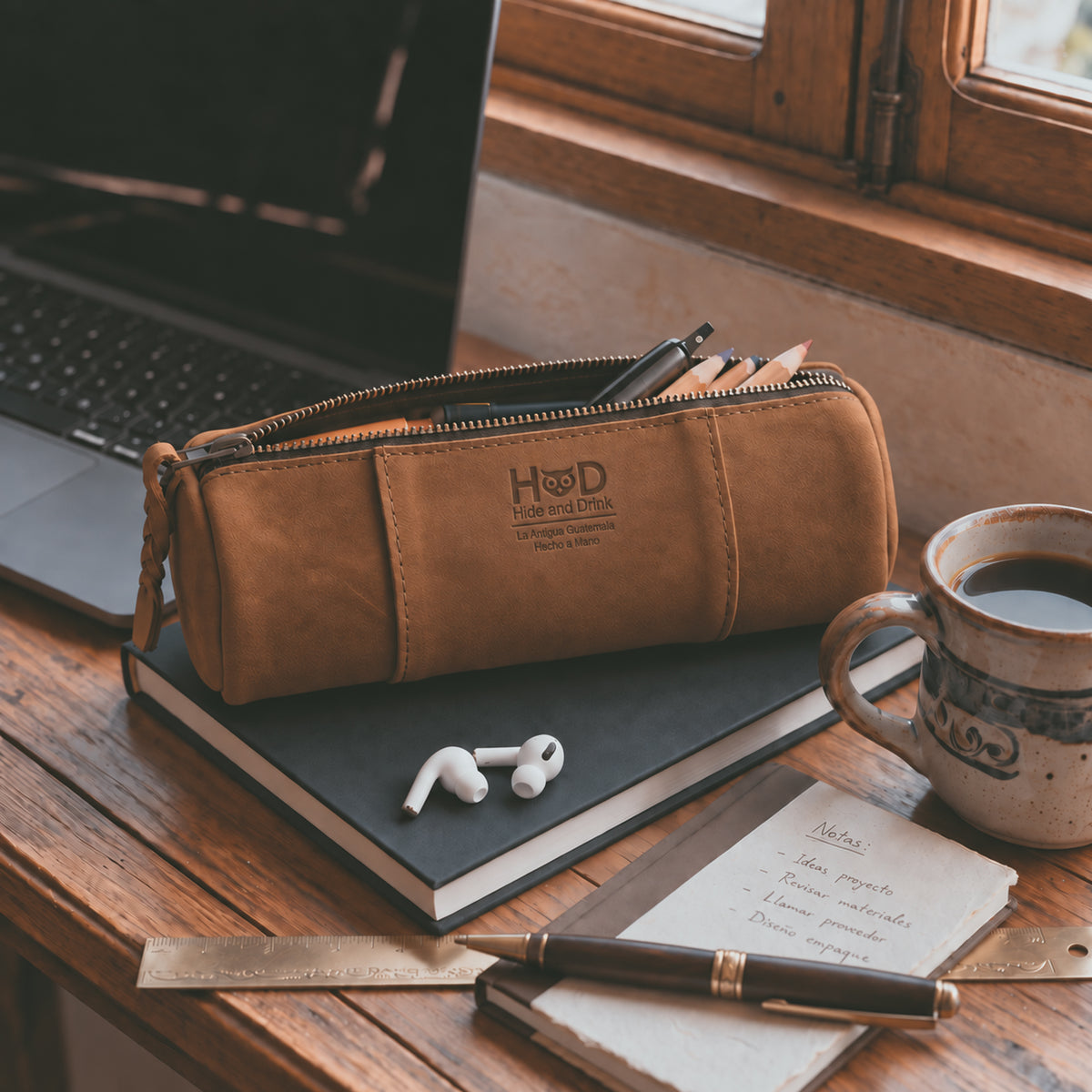 Inside view of the Utility Cylinder Case by Hide & Drink, featuring ample space for organizing cables and personal items. This rustic design is crafted in small batches from Full Grain Leather. Cylinder Case, Handmade, Classic Bag.