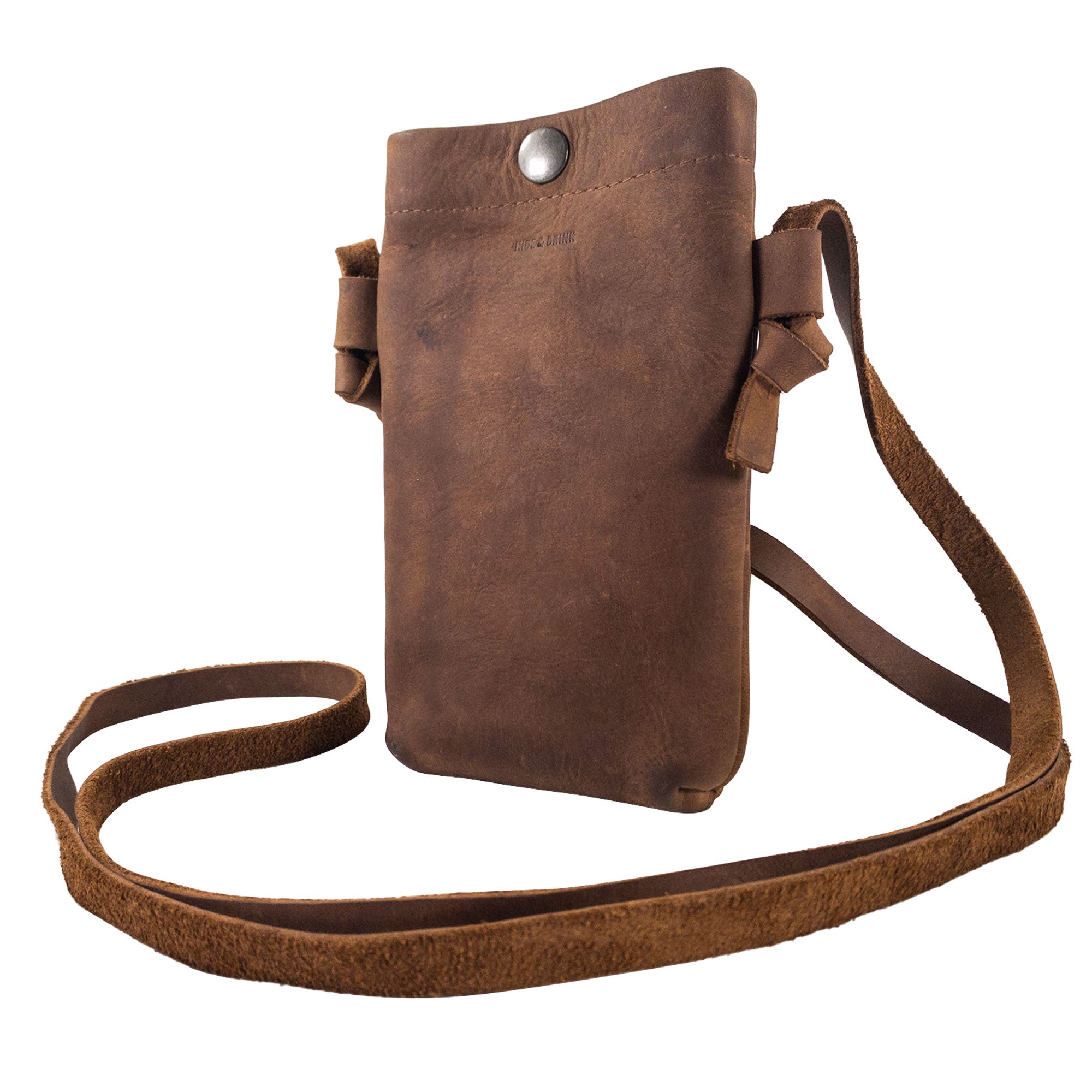 Side angle of the Hide & Drink Cell Phone Shoulder Bag, featuring a unique design with its soft full grain leather. This versatile shoulder bag or crossbody bag for cellphone use combines style and functionality, crafted with care by artisans in La Antigua Guatemala & Oaxaca Mexico, emphasizing quality and small batch production.