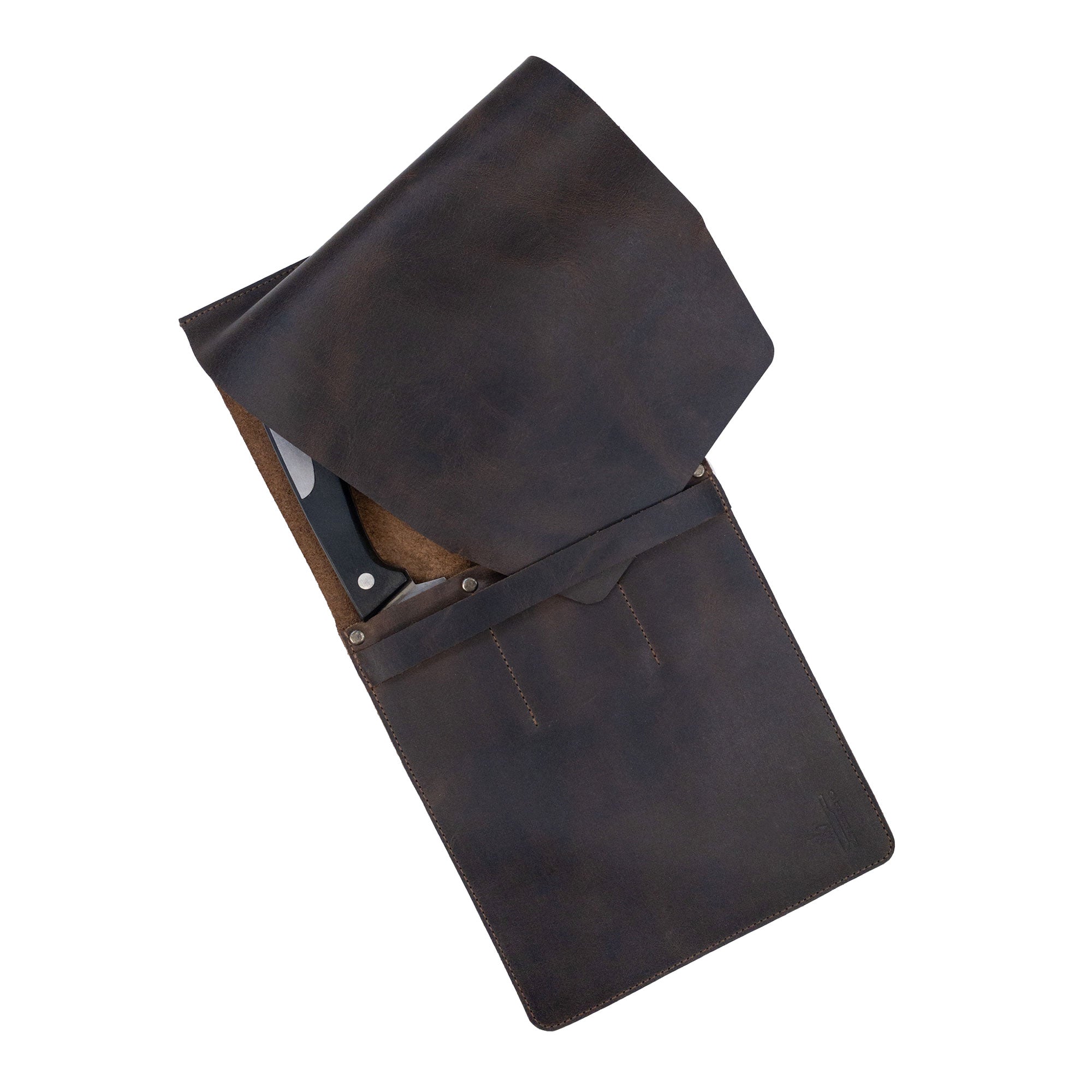 The Knife Case with 3 Slots by Cast Leather Co. partially opened, revealing the beautifully textured full grain leather. This knife organizer offers rustic storage for kitchen utensils, emphasizing small batch production, hand-cutting, hand-sewing, and fire branding for an artisan feel, all handmade in La Antigua Guatemala & Oaxaca Mexico.