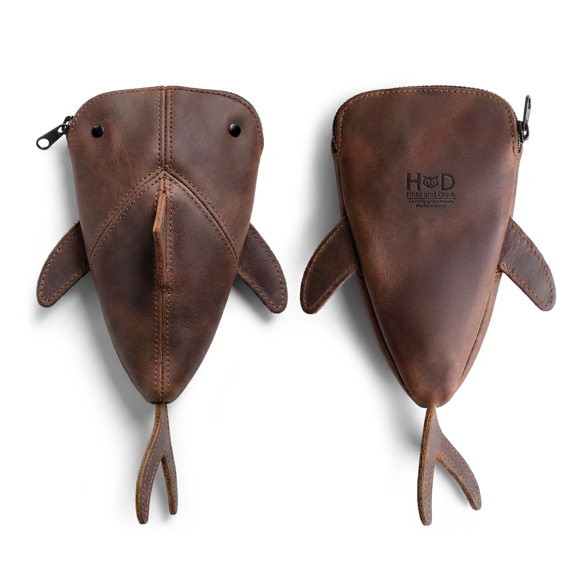 Back view of the Leather Shark Pouch by Hide & Drink, featuring its distinctive shark shape, perfect for use as a change bag or a makeup pouch, made from full grain leather, highlighting the artisan’s dedication to small batch production in La Antigua Guatemala & Oaxaca Mexico.