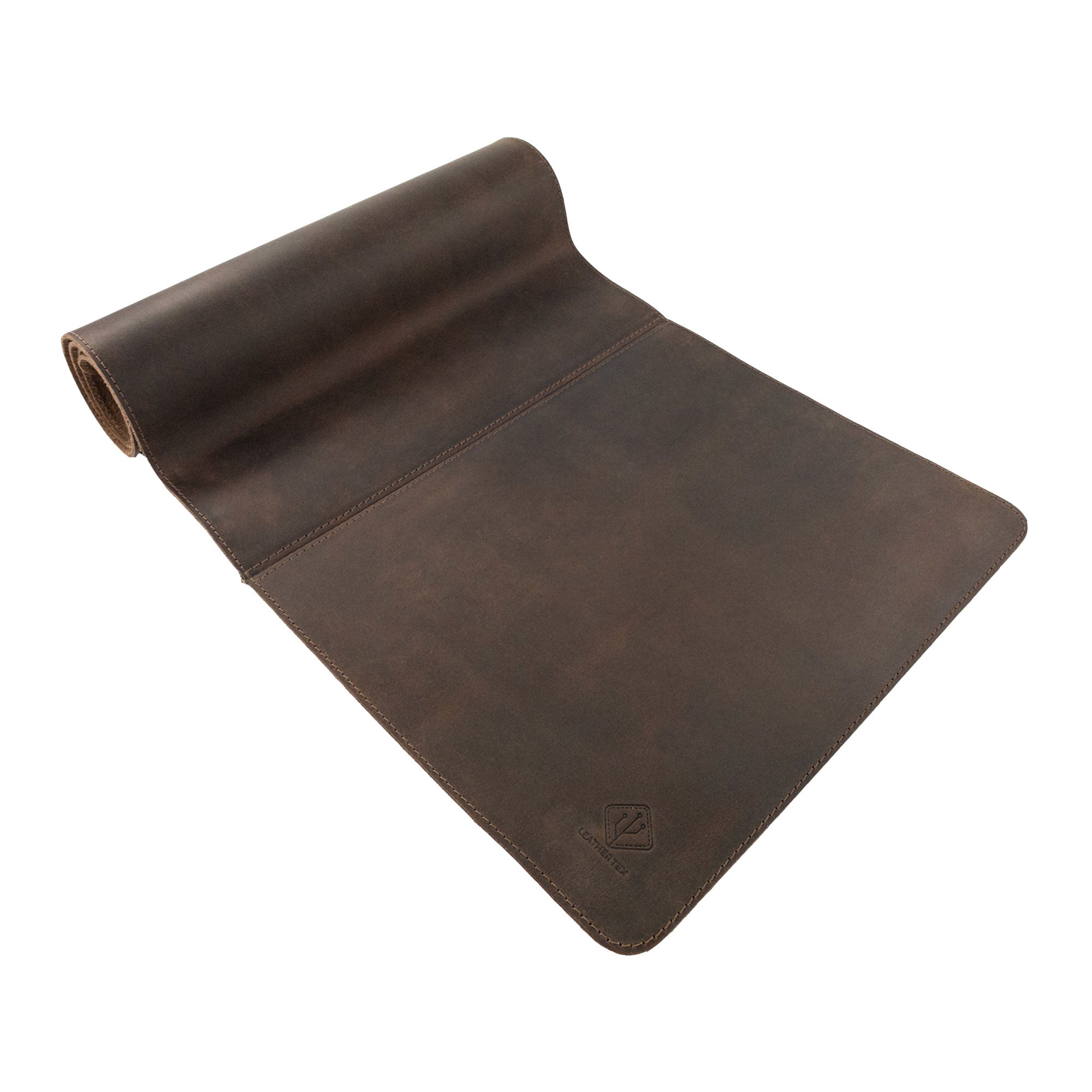 An open display of the 34 Inch Long Desk Pad for Keyboard, Mouse, and Cellphone by LeatherTex, featuring elegant full grain leather. Made with precision through small batch production, this artisan product showcases hand cut, hand sewn elements, and fire branding, representing the artistry of local craftsmen in La Antigua Guatemala & Oaxaca Mexico.