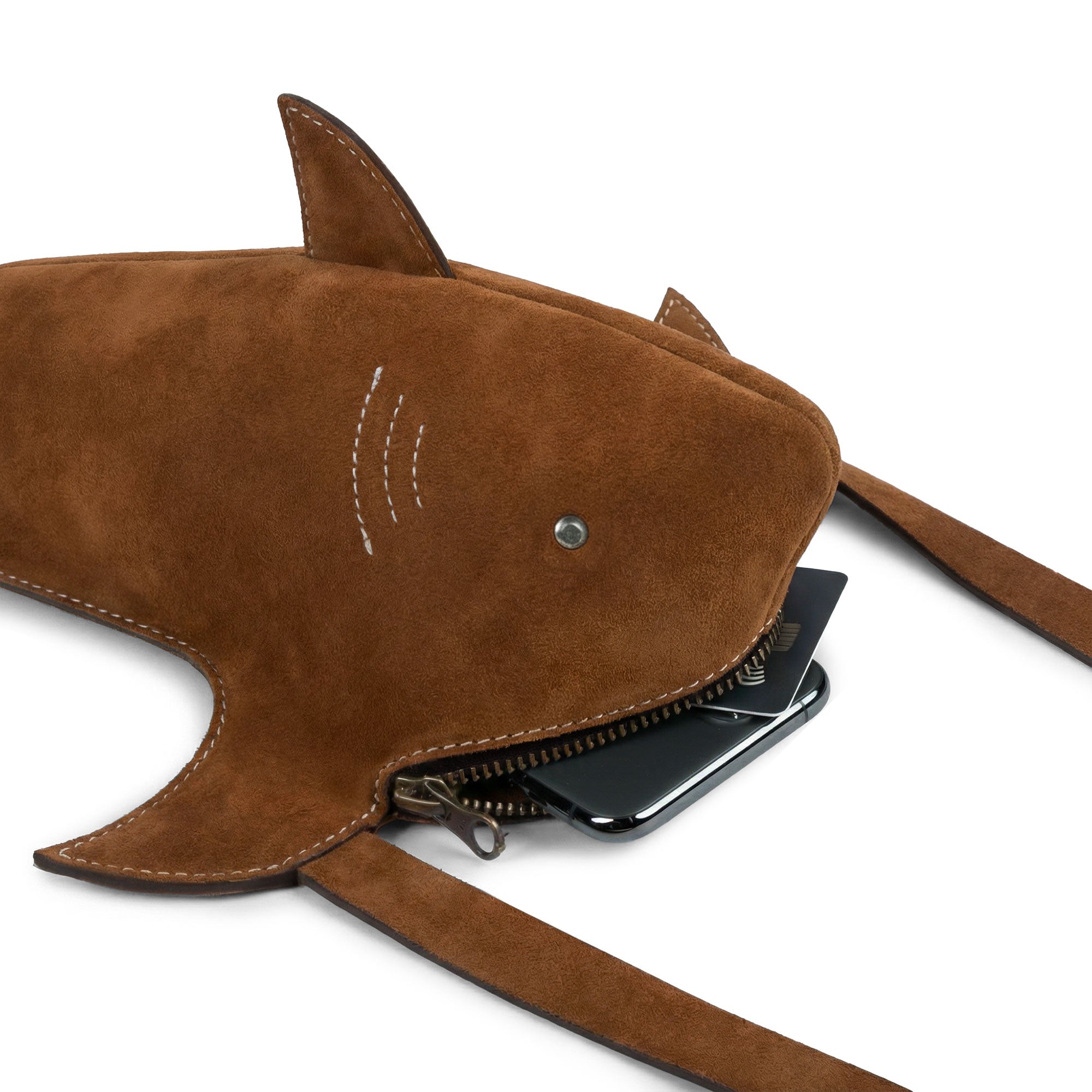 Practical view of the Shark-Shaped Shoulder Bag by Tudi Frudi, showcasing its compact design and spacious interior. Made from Full Grain Leather, this bag features an adjustable strap for versatile wear as a crossbody, messenger, or shoulder bag. Each bag is handcrafted in La Antigua Guatemala, highlighting the artisan quality of this unique accessory.