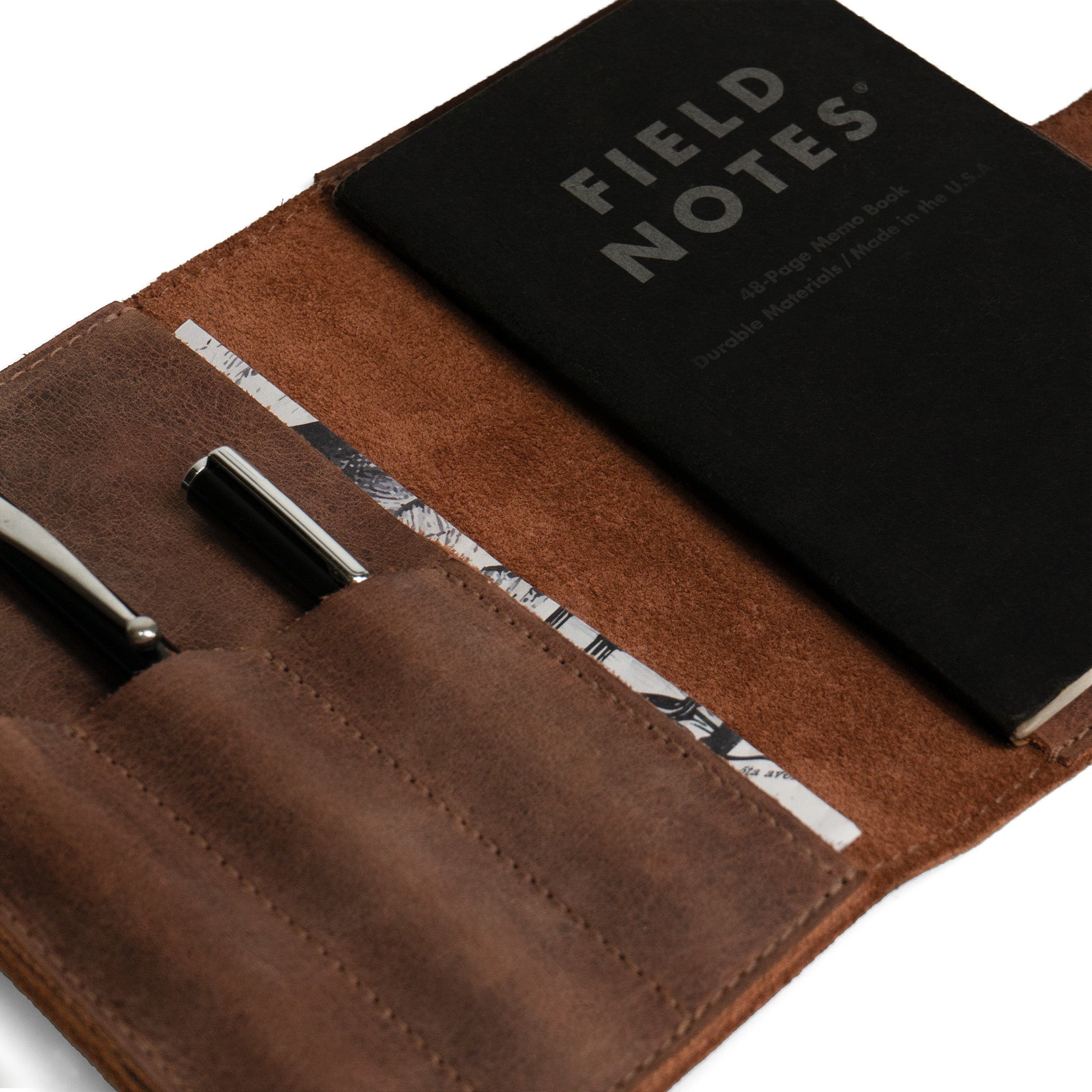 Close-up of Leather Worx Field Notes Cover 3.5 x 5.5 in. Cover with Pen Slots, featuring the durable and luxe Full Grain Leather material. This notebook case is designed with pen slots, ensuring easy access. A sleeve for your notebook that showcases the craftsmanship of StockyardX, handmade in La Antigua Guatemala and Oaxaca Mexico.