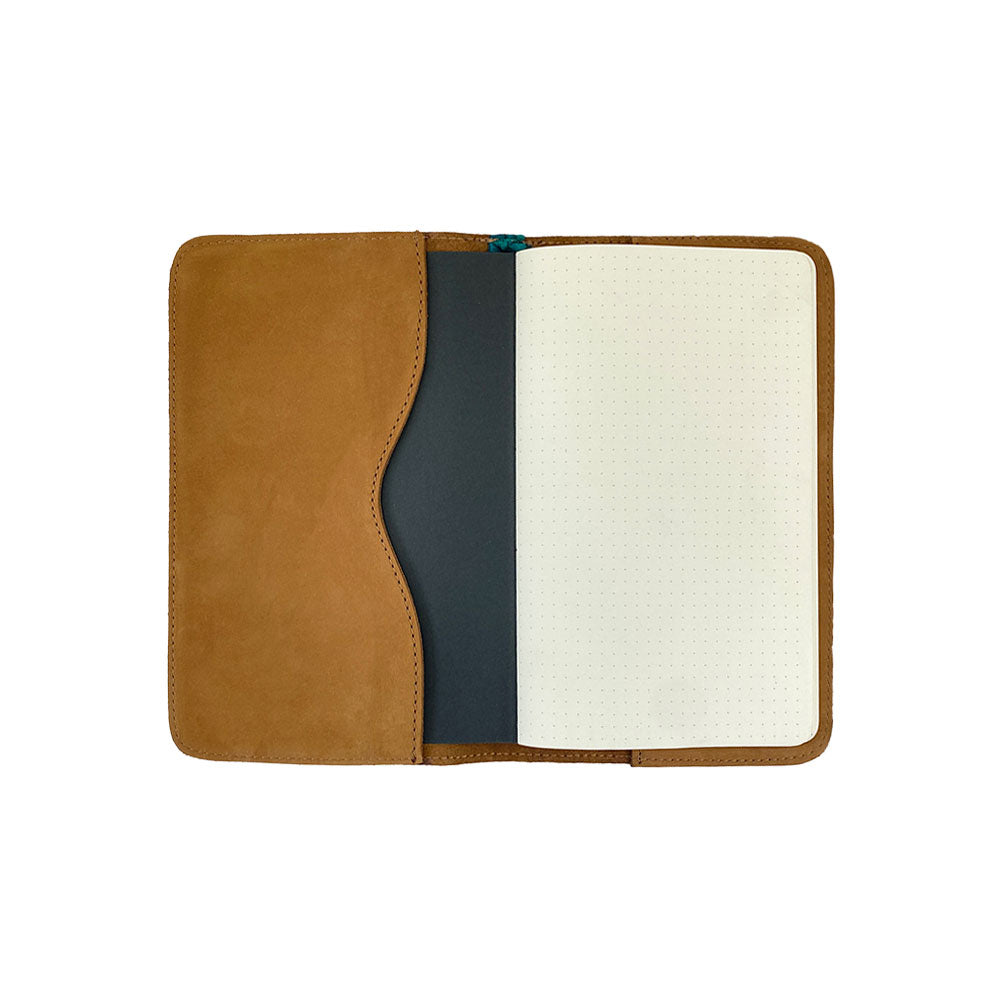 Back view of a brown Journal Cover for Moleskine Cahier L (5 x 8.25 in.) by Hide & Drink, designed for durability. This artisan crafted cover is a perfect rustic protector for large size (5 x 8.25 in.) notebooks, made from premium full grain leather.