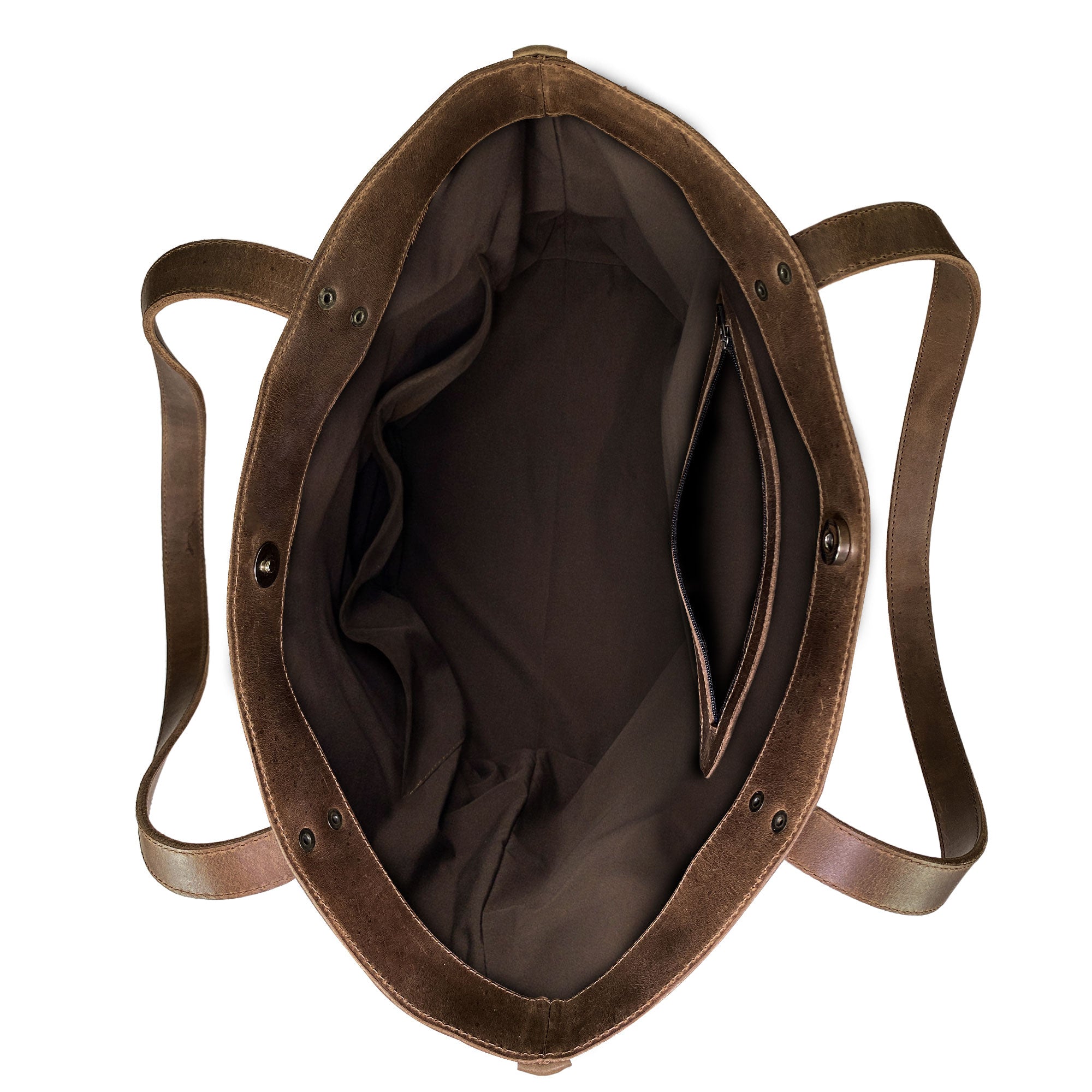 Western Leather Works Formal Tote Bag showcasing its elegant inner side lined with plaid cotton. Crafted from Hair on Hide Full Grain Leather, this bag is spacious and perfect for various uses. Its handmade nature ensures a durable design that embodies artisan quality. Handmade in La Antigua Guatemala & Oaxaca Mexico.