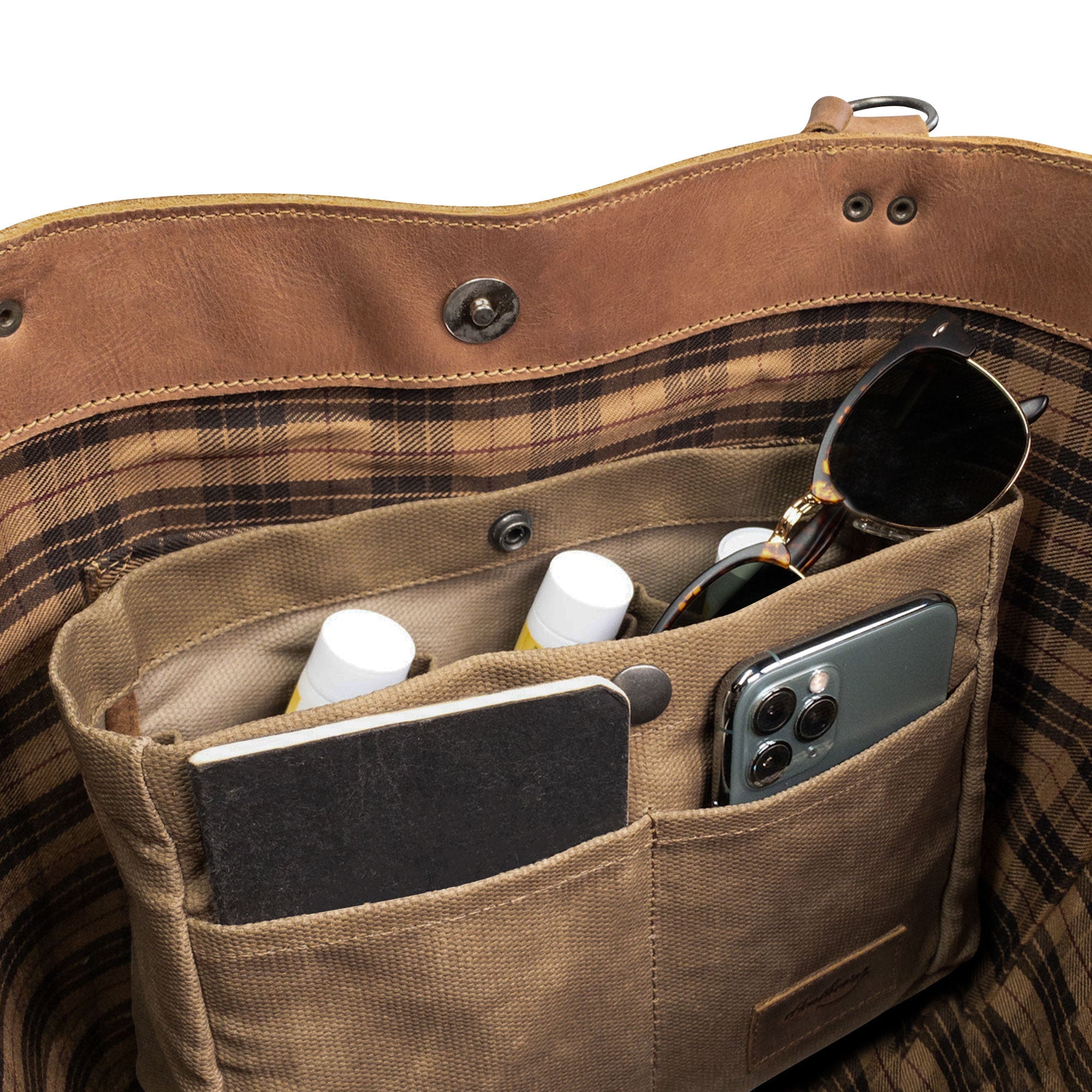 Inside view of Heather's Purse Organizer Insert, made of Waxed Canvas, showing spaces for organized storage. Ideal for cellphone storage and other essentials, this artisan-crafted product supports local artisan work in La Antigua Guatemala & Oaxaca Mexico.