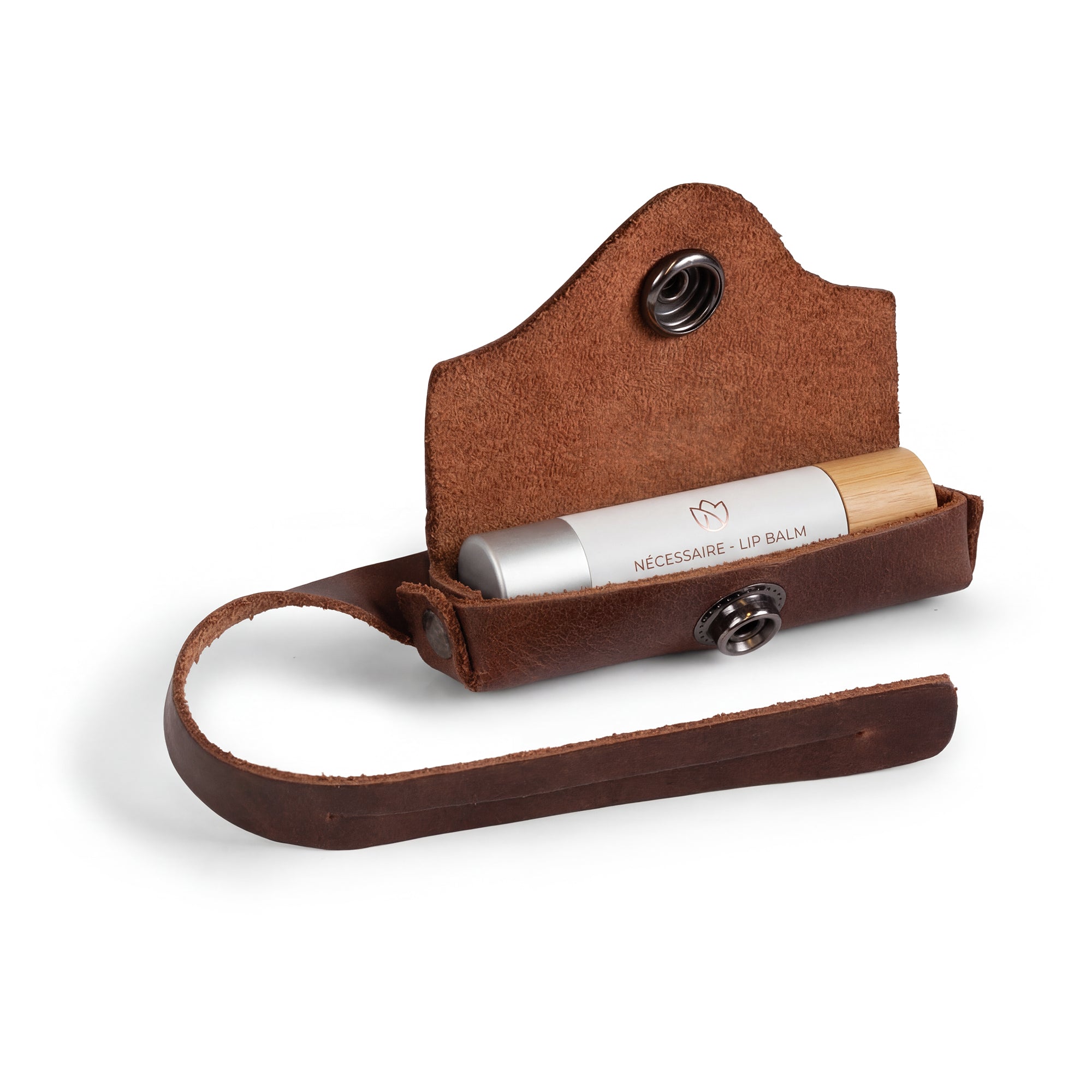 Hide & Drink Lip Balm Holder Bag Charm with lip balm tucked inside, combining functionality and style. It serves as a Lip Balm Charm for Handbags, Purse Charm for Tote & Backpacks, made with full grain leather and embodies small batch production from La Antigua Guatemala & Oaxaca Mexico.