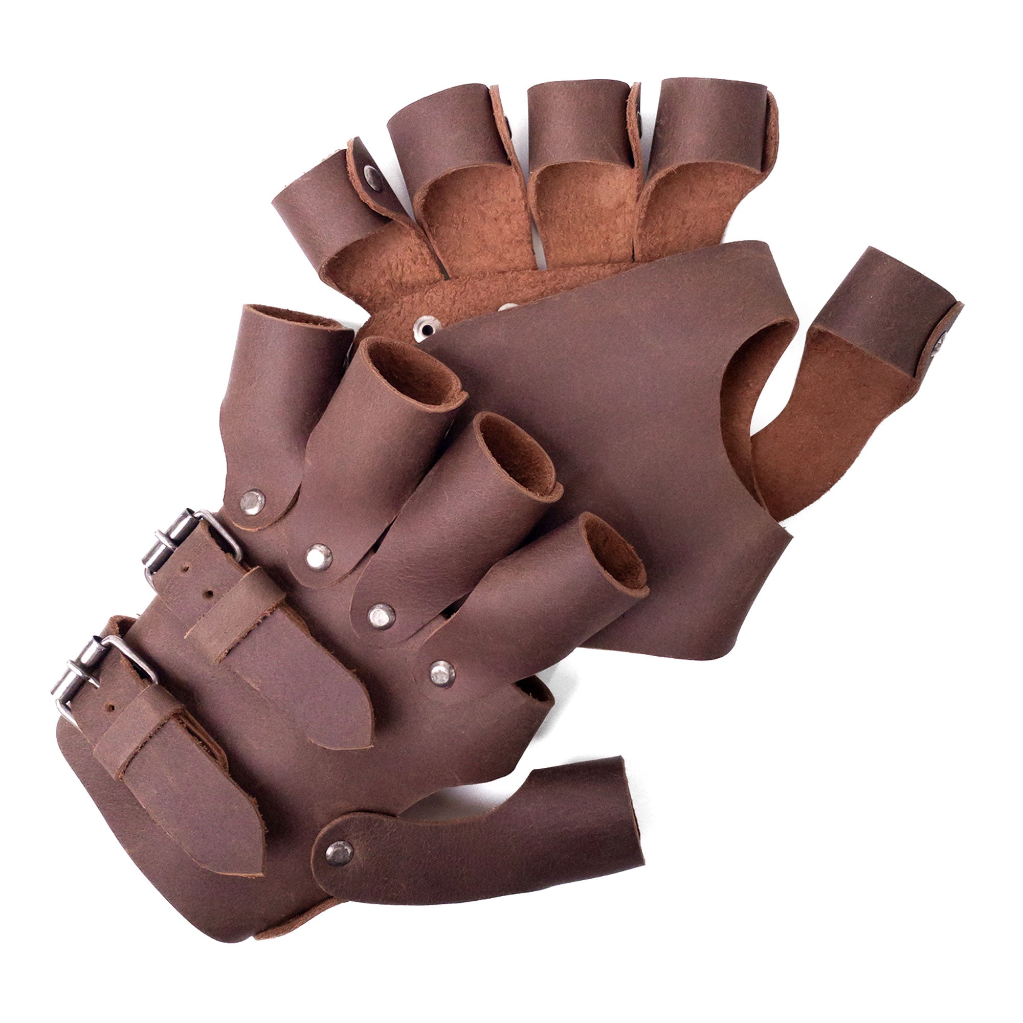 A detailed view of the Set of 2 Steampunk Gloves arranged artistically, showcasing buckles and gear details. Crafted by Hide & Play from full grain leather, these vintage gloves are ideal costume accessories for cosplay and reflect handmade artistry from La Antigua Guatemala.