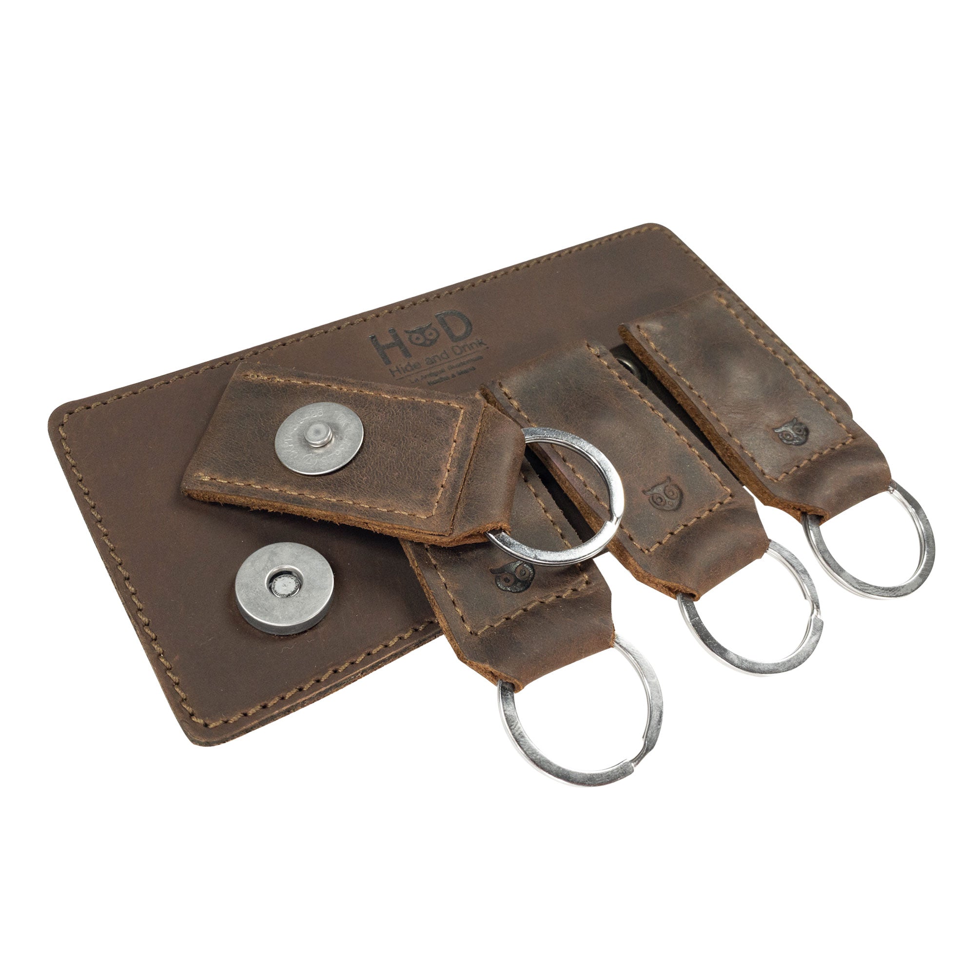 Magnetic Keychain Holder by Hide & Drink featuring a seamless design with key rings and buttons. Crafted from full grain leather, this organizer is a stylish accessory that reflects artisan skill. Perfect for wall decor and functional use, handmade in La Antigua Guatemala & Oaxaca Mexico.