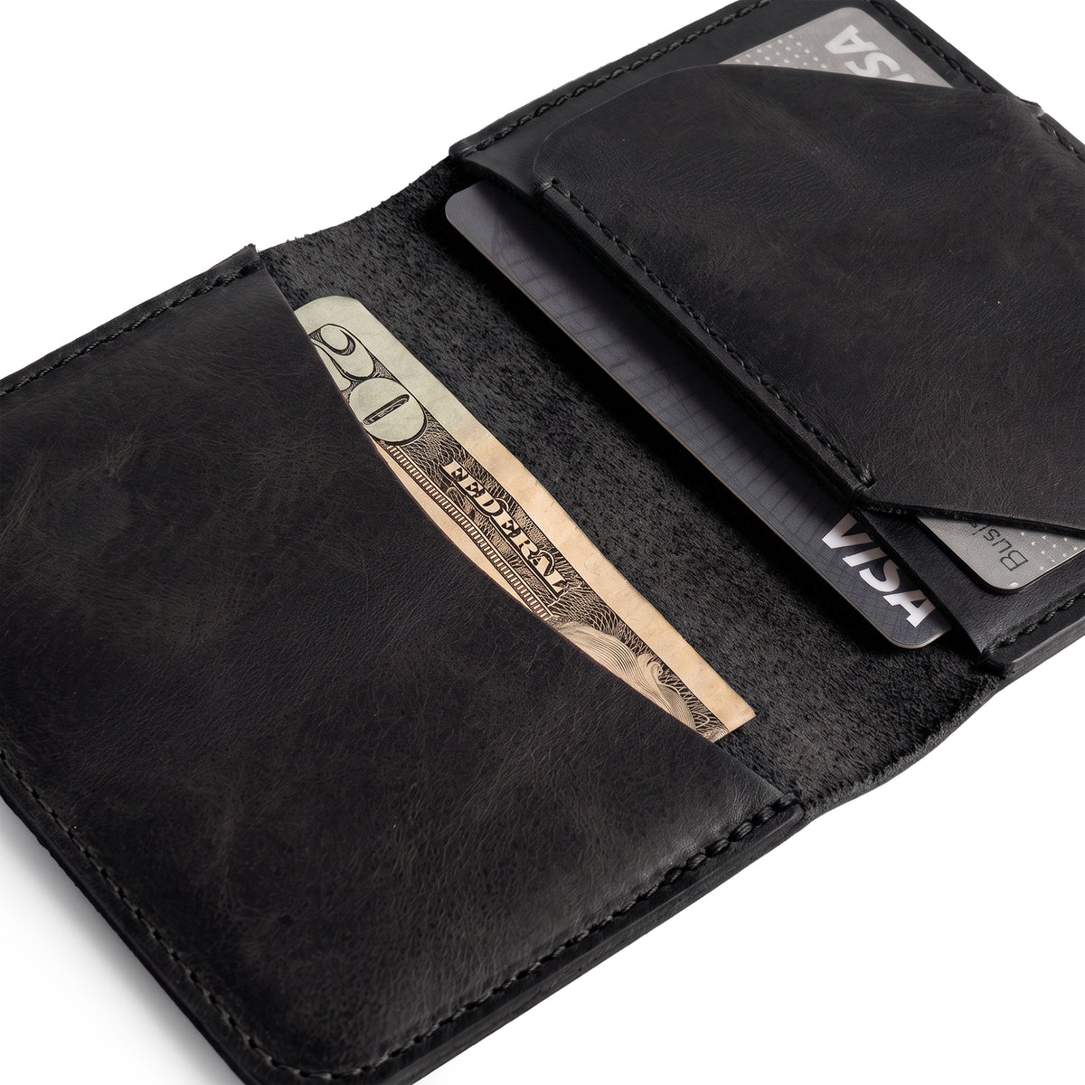 Black Bi-Fold Card Wallet Diagonal by Hide & Drink opened with cards and cash, illustrating its functionality and elegant design; made from full grain leather for those seeking quality accessories.