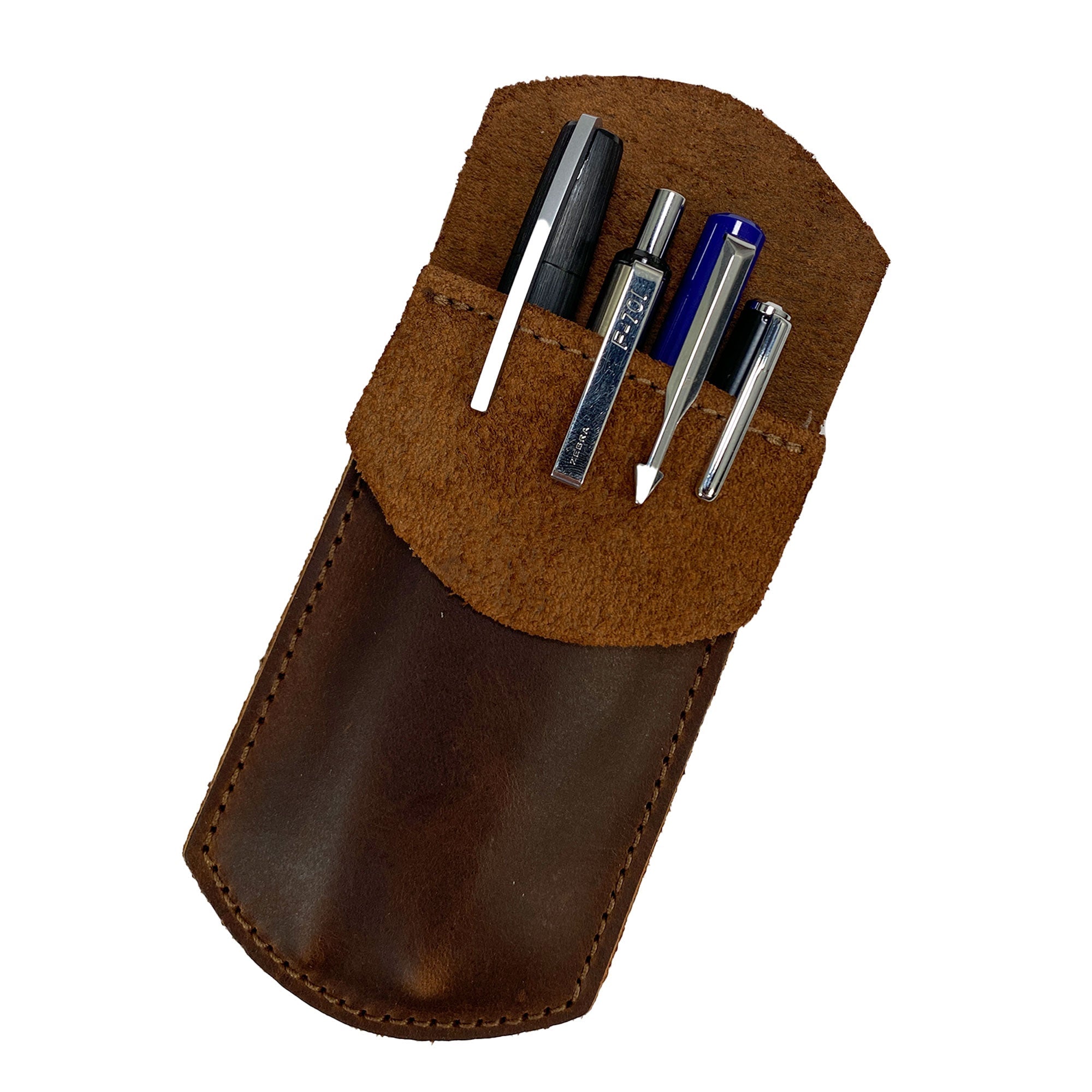 Heavy Duty Hide Pen Pocket filled with various pens, demonstrating its practicality as a pencil pouch and pen holder. Made from high-quality full grain leather, this item is perfect for storing writing instruments in shirt pockets, lab coats, and backpacks. Crafted with care in La Antigua Guatemala, it represents excellence in small batch production by StockyardX.