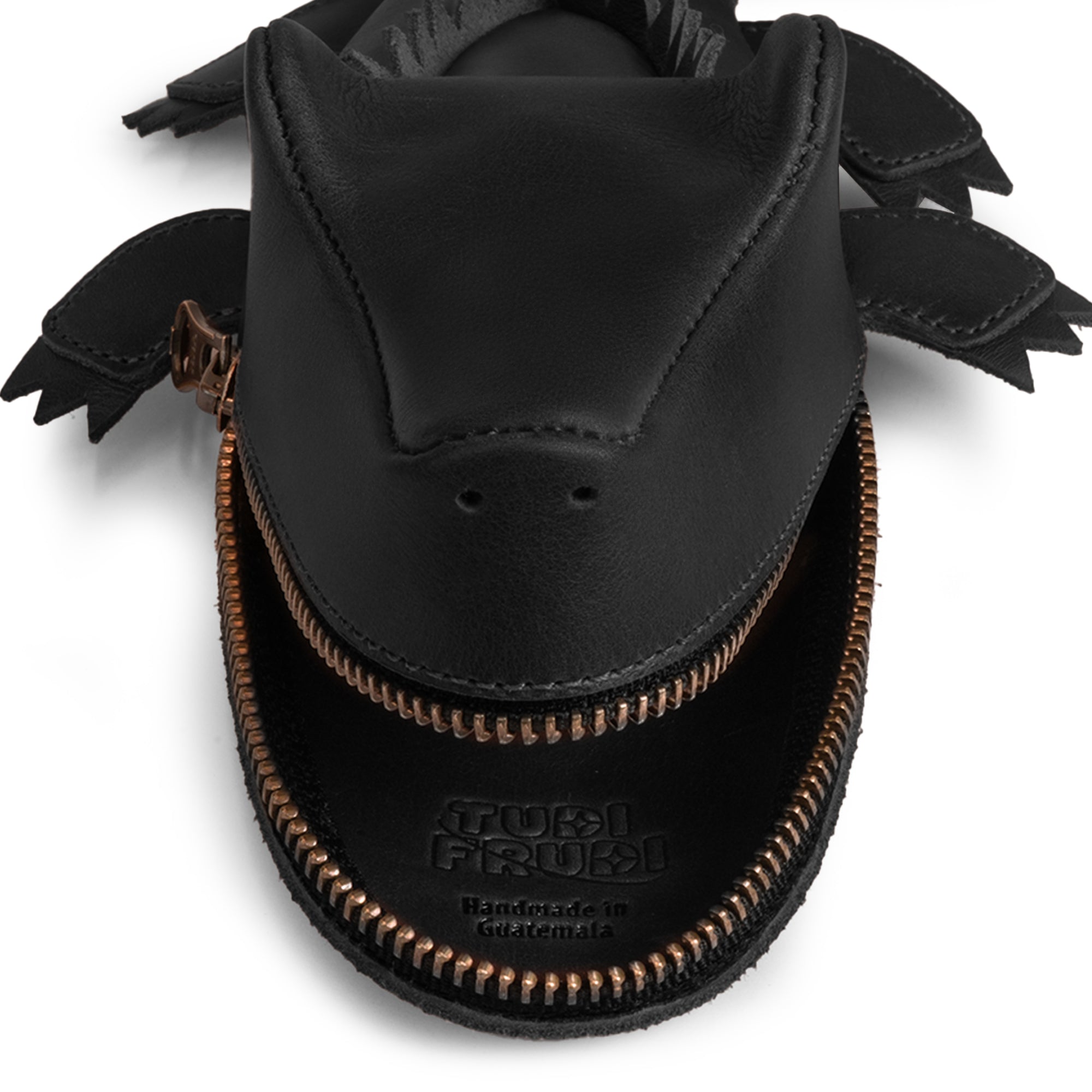 Top view of the Leather Gator Pouch by Tudi Frudi, emphasizing the leather quality and design. This crocodile-shaped pencil pouch doubles as a functional alligator-shaped coin purse, crafted from full grain leather using small batch production methods in La Antigua Guatemala & Oaxaca, bringing artisanal quality to your everyday essentials.