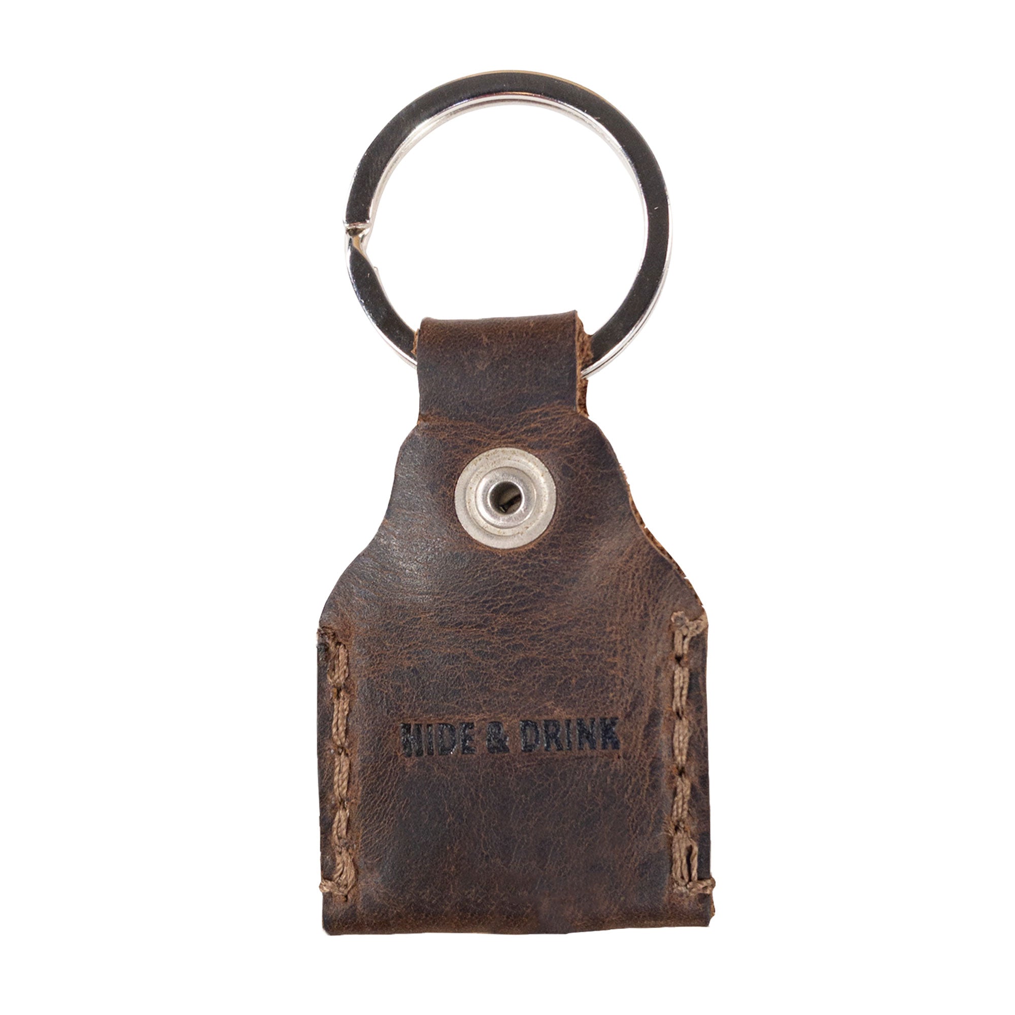 Reverse side of Hide & Drink Key Holder displaying the brand logo, emphasizing quality craftsmanship in Full Grain Leather. This Key Holder makes a practical Keychain Organizer and an essential emergency coin pouch. Handmade in La Antigua Guatemala & Oaxaca Mexico, showcasing the beauty of artisan craftsmanship in small batch production.
