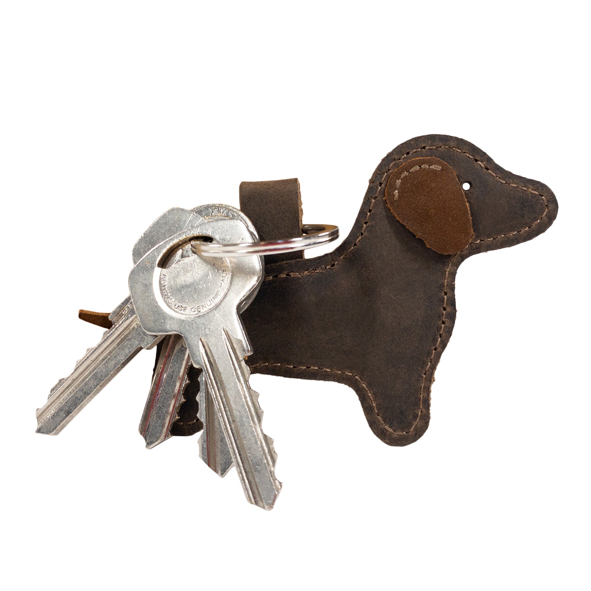 Here’s the Hide & Drink Dog Keychain with keys attached, illustrating its functionality and style. This Dachshund-inspired keyring, made from durable Full Grain Leather, showcases the brand’s dedication to artisan craftsmanship, handmade in La Antigua Guatemala & Oaxaca Mexico.