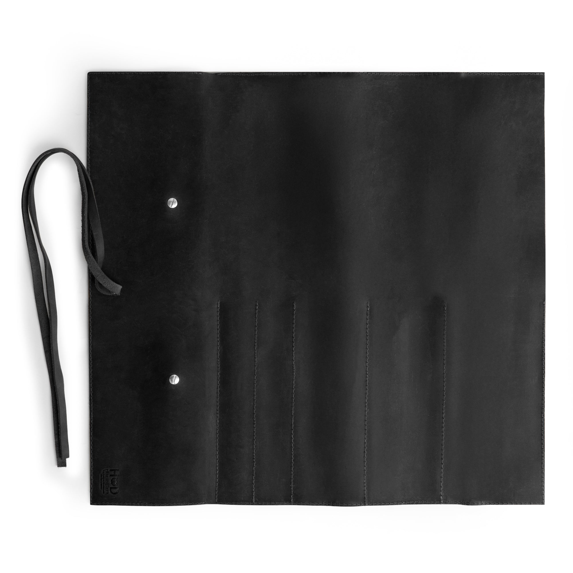 Hide & Drink Knife Roll (5 Pockets) exhibited with its interior design made from durable Full Grain Leather. This Chef Knife Bag acts as a practical portable carrying case for knives, embodying handmade quality from small batch production, hand cut, and hand sewn craftsmanship.