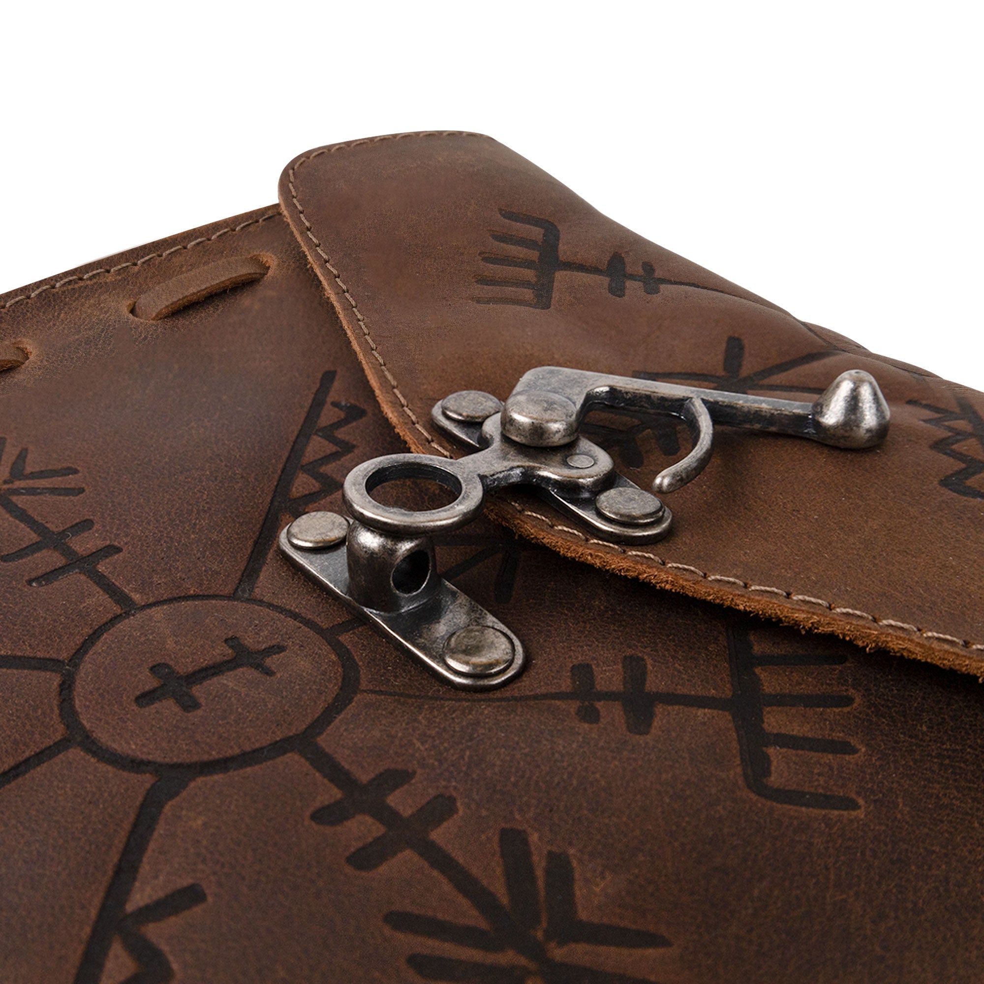 Close-up of the clasp on Hide & Play's Rune Belt Pouch, showcasing the quality craftsmanship. This medieval style waist bag is not just a great costume accessory but also a durable Viking waist bag made from full grain leather, hand cut and sewn by artisans in La Antigua Guatemala.