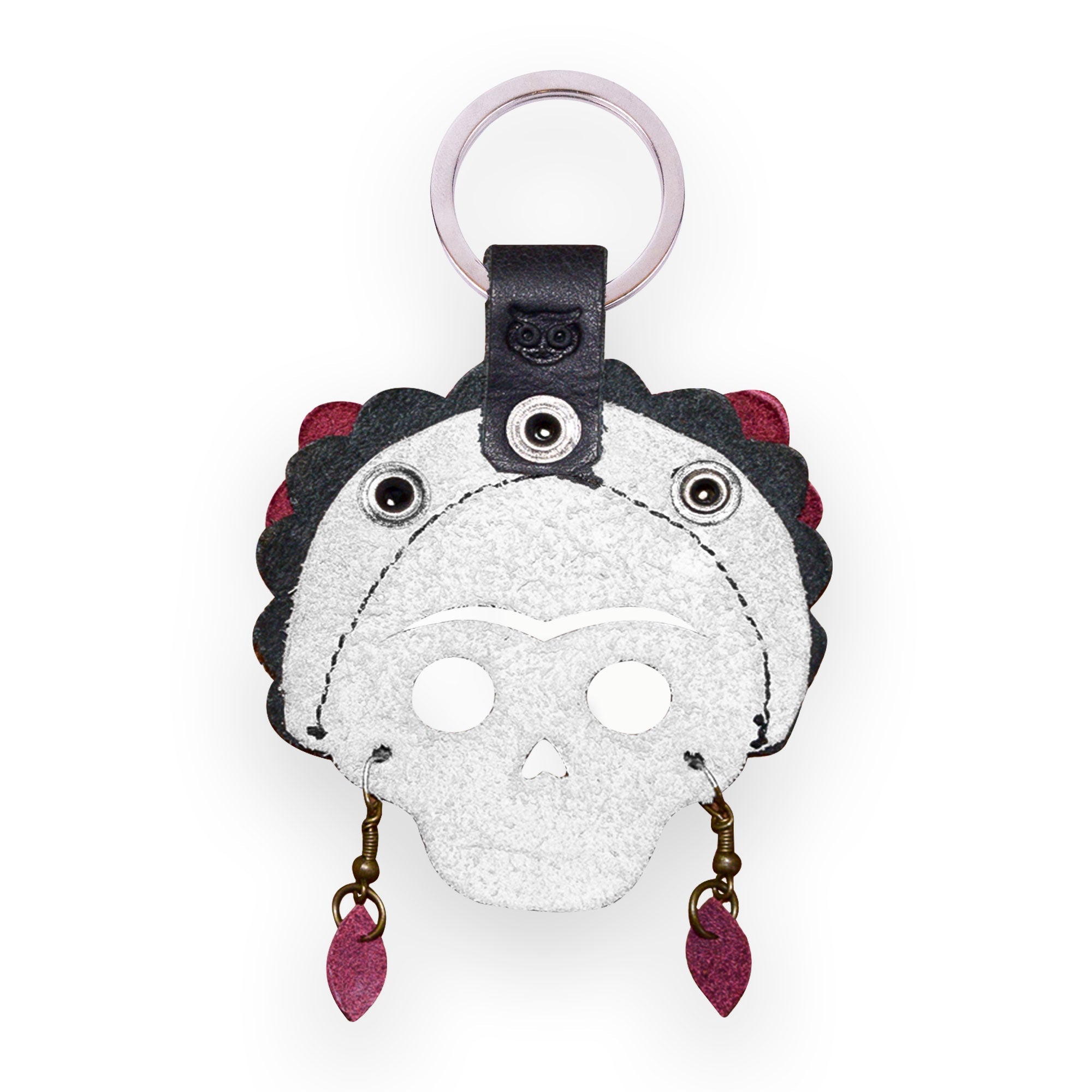 Artistic view of the Lady Skull Leather Keychain by Hide & Drink, showcasing its unique design inspired by Dia De Los Muertos. This keyring serves as a stylish key organizer, representing Mexican culture. Crafted from Full Grain Leather, it's handmade by artisans in La Antigua Guatemala and Oaxaca Mexico.