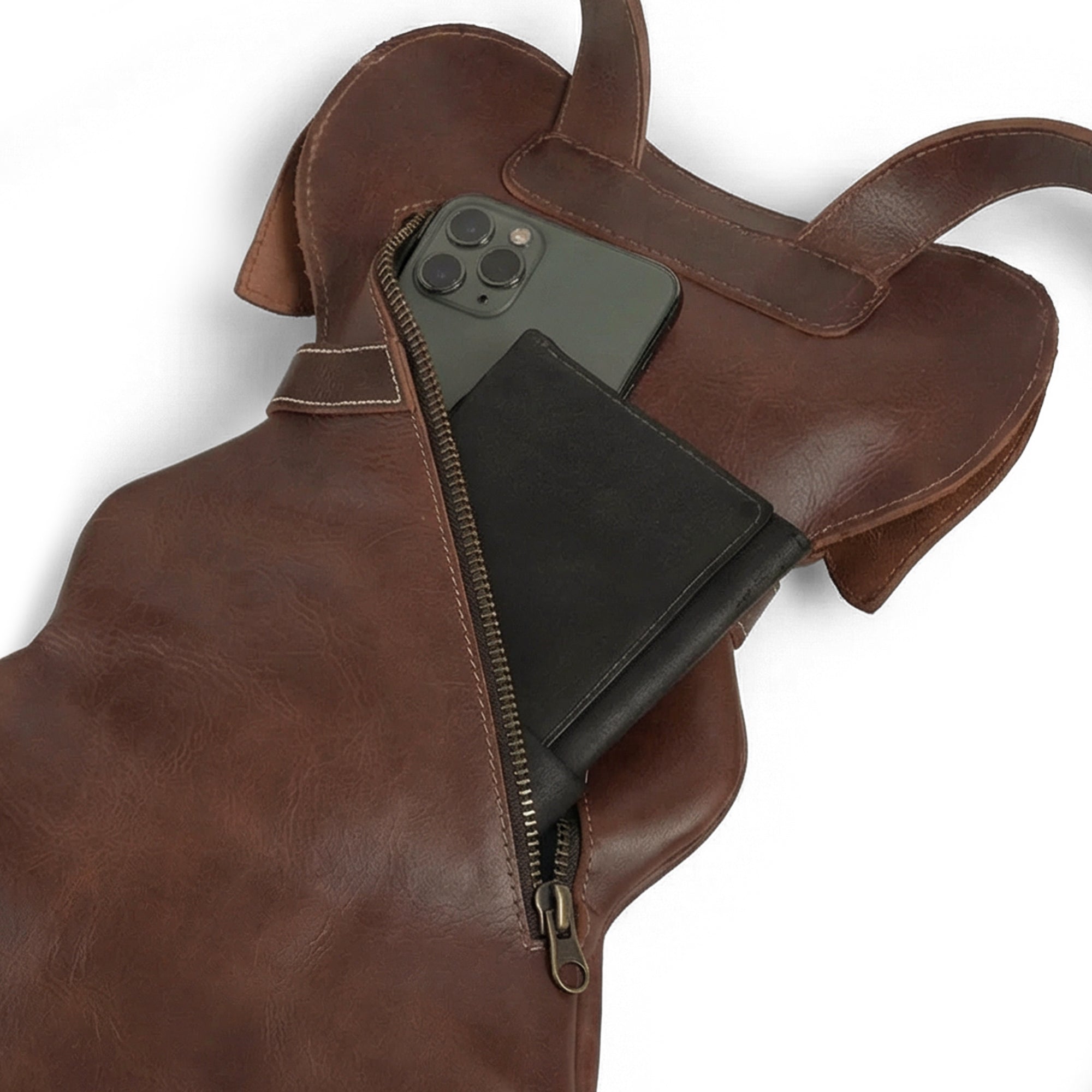 Inside the Doggy-Shaped Backpack by Hide & Play, demonstrating its spacious interior designed for everyday essentials. This Handmade Doggy-Shaped Backpack features a stylish look and practicality for pet lovers, crafted from full grain leather with hand cut and sewn details.