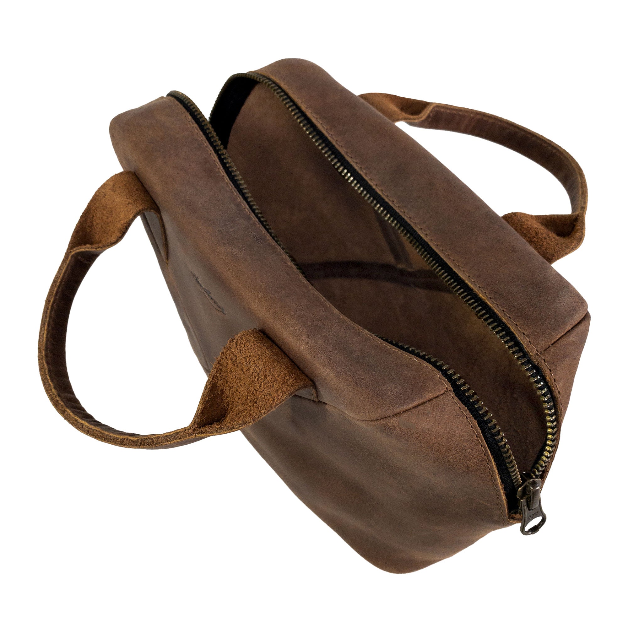 The top view of Heather's Fluffy Purse emphasizing its sturdy zippers and Full Grain Leather design. This Leather Fluffy Purse stands out as a premier Handbag for Women, serving as a perfect Night Bag or Rectangular Purse with Zipper. Artisans focus on Small Batch Production techniques, leading to a Hand Cut and Hand Sewn creation, Fire Branded, and handmade with care in La Antigua Guatemala & Oaxaca Mexico.