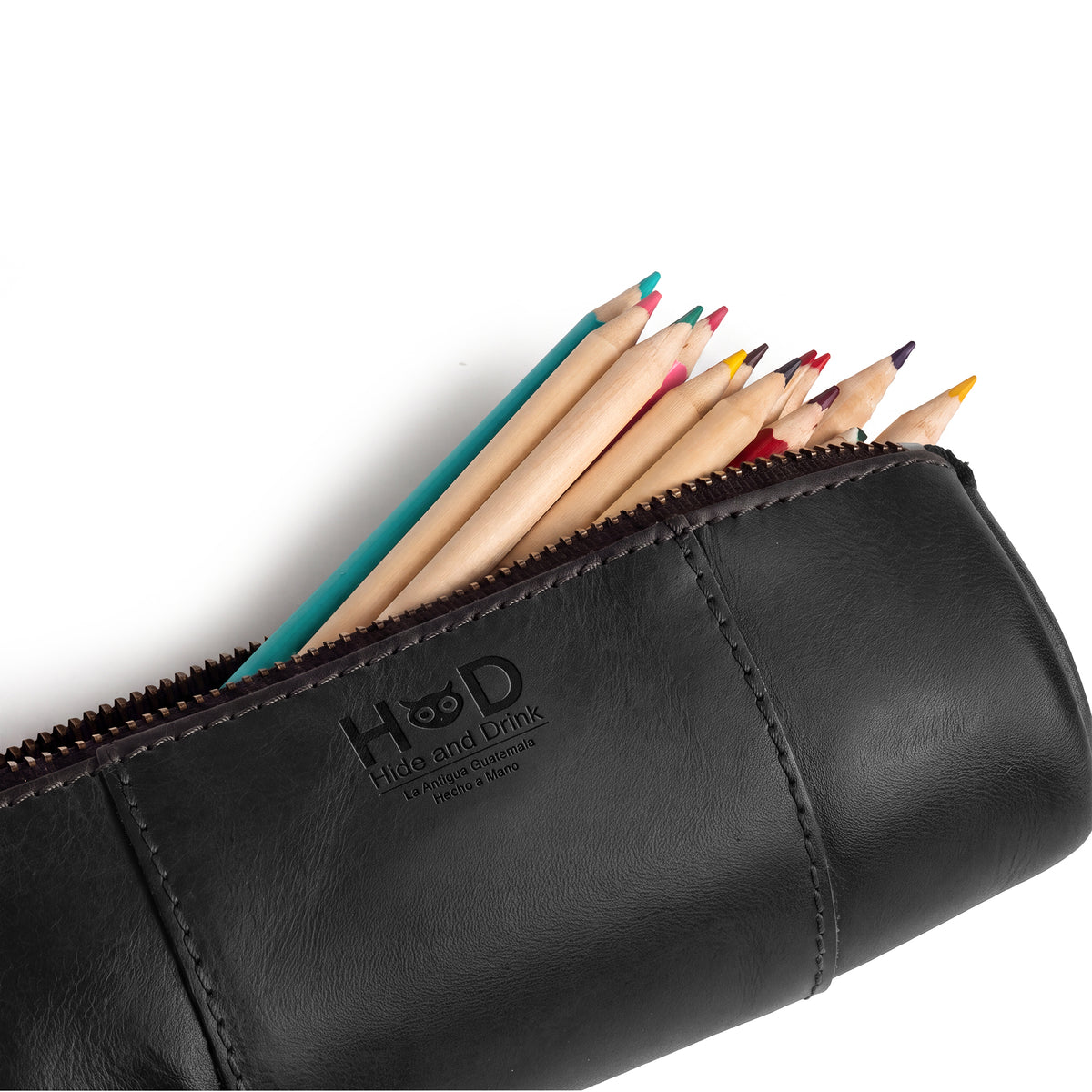 Utility Cylinder Case by Hide & Drink in black leather, designed for personal items or office supplies. This small batch, artisan bag showcases the beauty of Full Grain Leather craftsmanship. Cylinder Case, Classic Bag, Handmade.