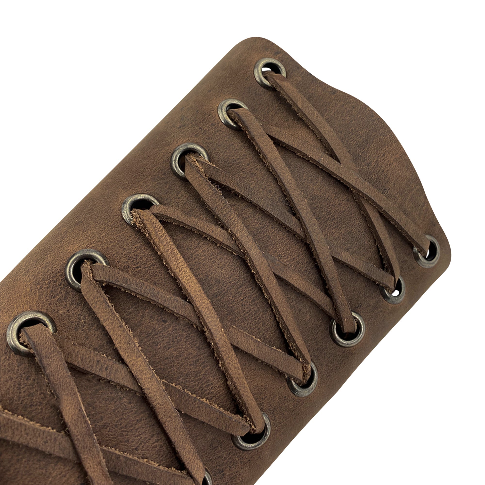 Valhalla Gear Archery Bracer - 2 pack featuring close-up details of the leather bracer's laces. This durable full grain leather serves as an effective hand protector for bow shooting practice. This outdoor sports armband is an artisan piece formed through small batch production, hand cut, hand sewn, and fire branded techniques, proudly handmade in La Antigua Guatemala & Oaxaca Mexico.