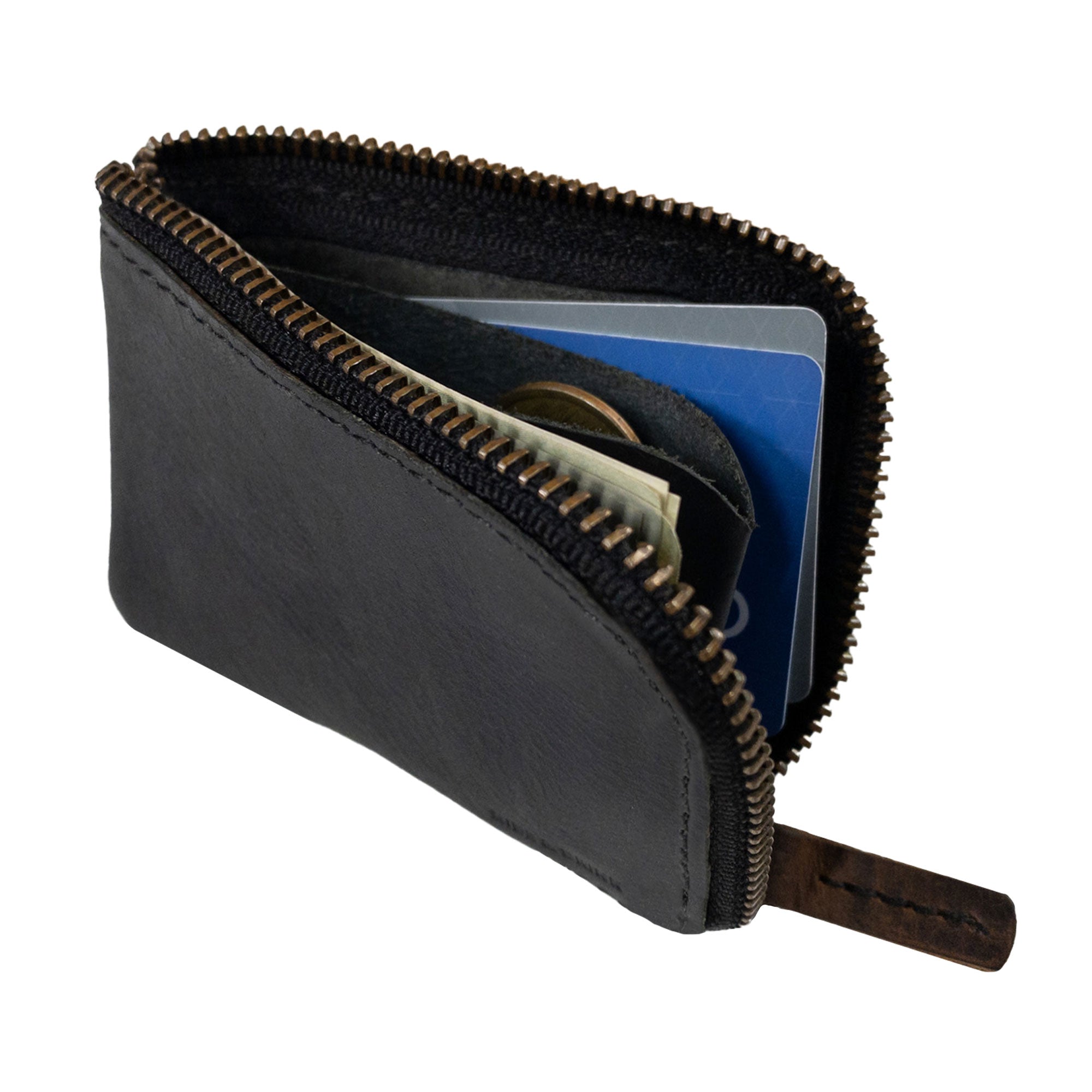 A user demonstrating the functionality of the black Hide & Drink Card Pocket Wallet in hand. This zippered card wallet for men and women acts as a coin pouch and money holder, artisan crafted from full grain leather in La Antigua Guatemala, ensuring quality and style.