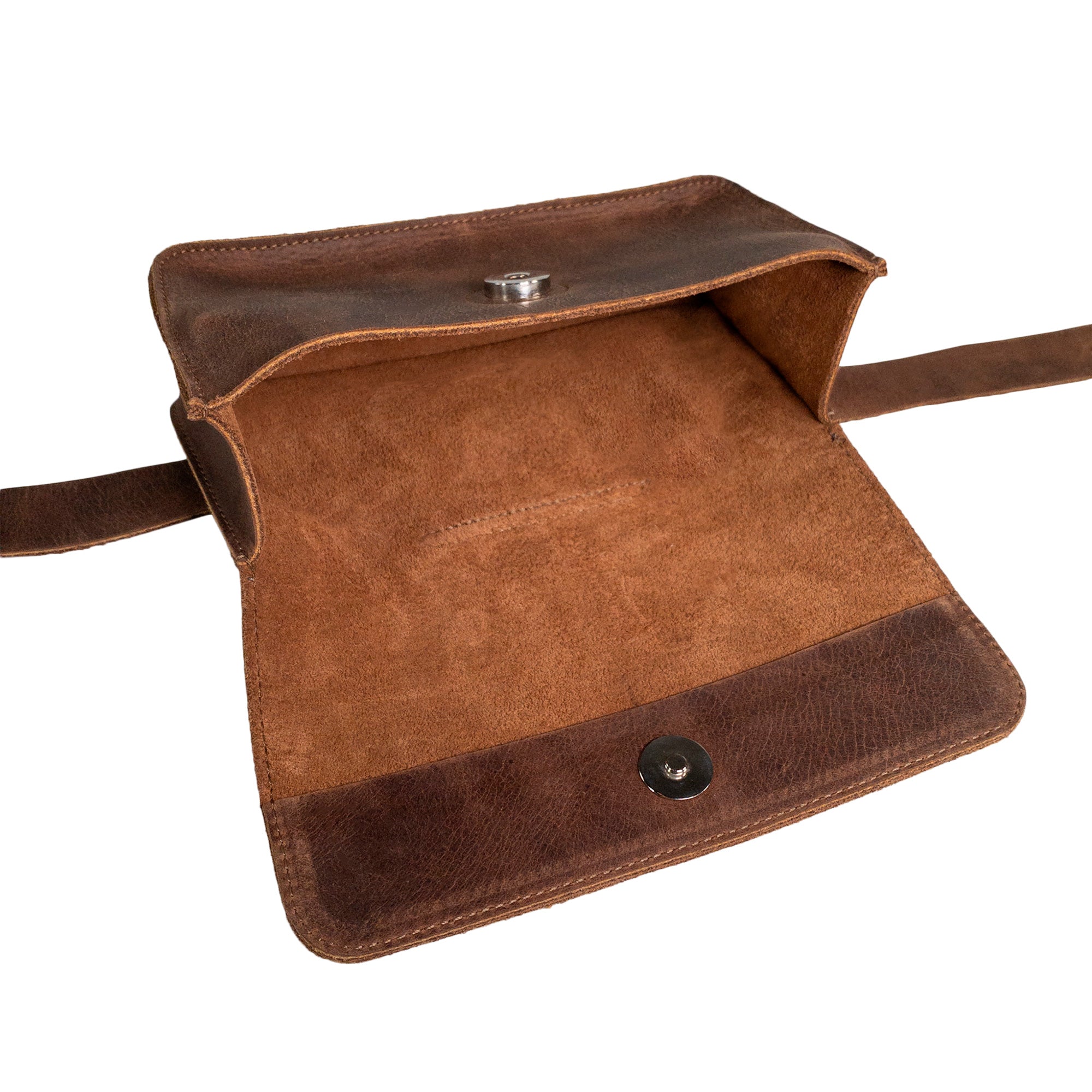 Open view of Heather's Rectangular Fanny Pack, demonstrating its elegant and functional interior. This waist pouch is designed from full grain leather, offering longevity and style. Perfect as a small batch production piece, it reflects artisan skills in every hand cut and hand sewn detail, all made in La Antigua Guatemala & Oaxaca Mexico.