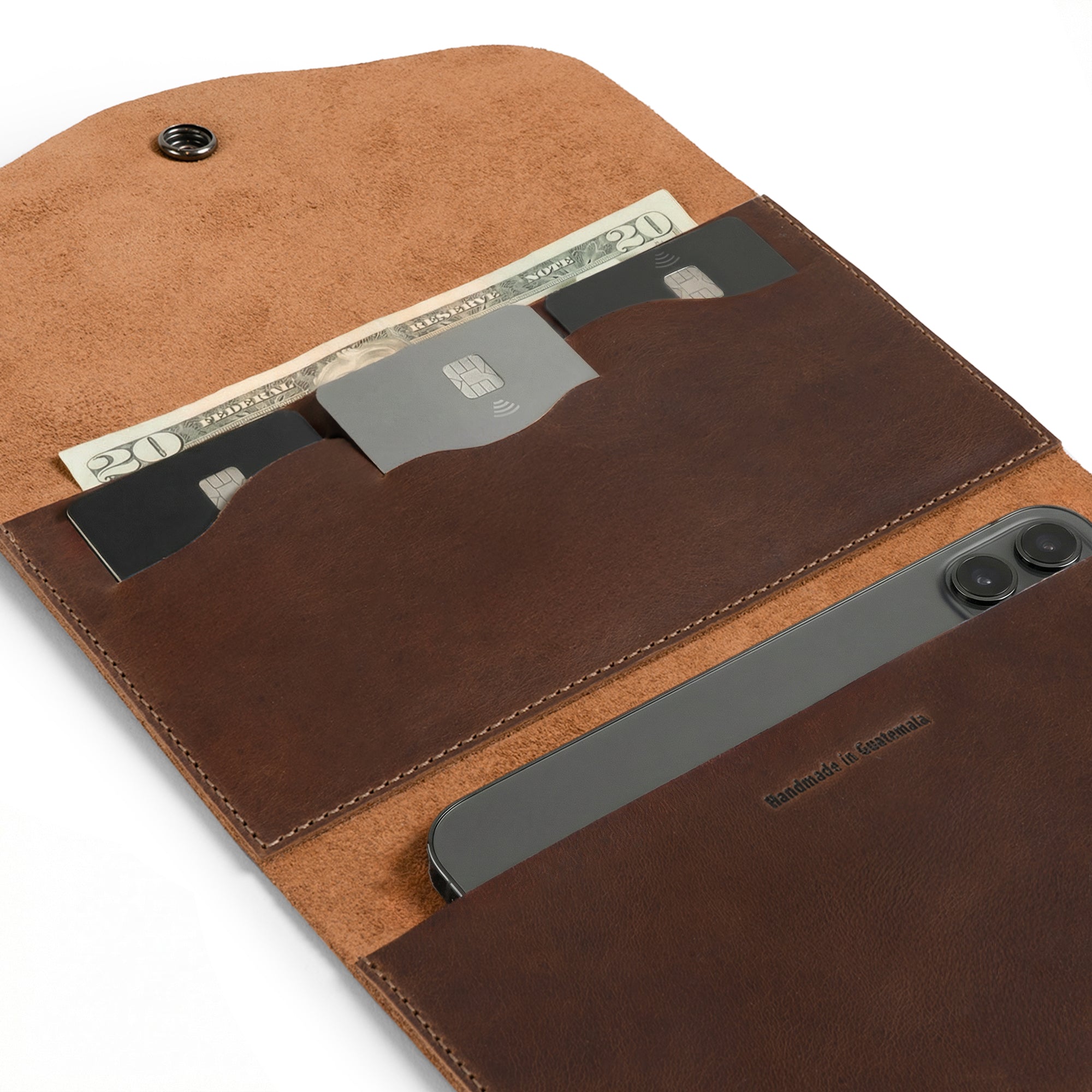 Close-up of The Violet Long Wallet by Austin Genuine, revealing card slots and a phone pocket crafted from luxurious full grain leather. This wallet embodies StockyardX's small batch production ethos, being hand cut and hand sewn by artisans in La Antigua Guatemala & Oaxaca Mexico.