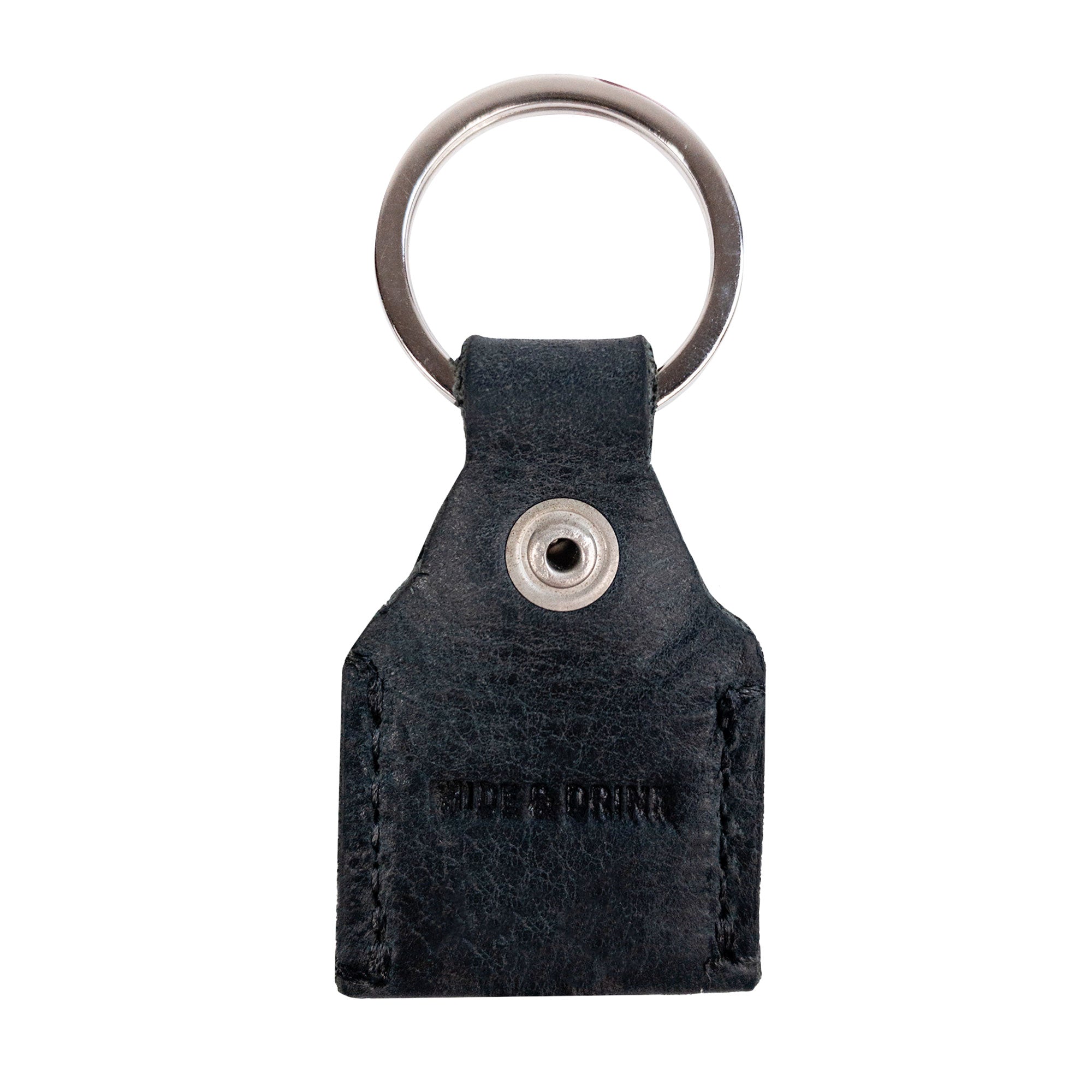 Reverse side of black Hide & Drink Key Holder featuring branding that signifies quality. This Key Holder is not just a Keychain Organizer but also serves as an emergency coin pouch made from genuine Full Grain Leather. Artisan-crafted in La Antigua Guatemala & Oaxaca Mexico, representing small batch production.