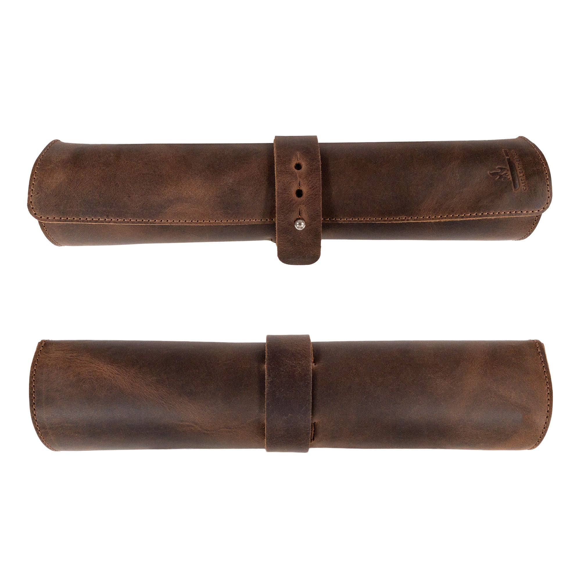 The Rectangular Knife Case with 3 Slots by Cast Leather Co. rolled up, featuring a secure strap that keeps knives safe. This stylish Portable Knife Organizer is an excellent Travel Bag for culinary accessories, exemplifying the fine craftsmanship of artisan goods handcrafted in Oaxaca Mexico.