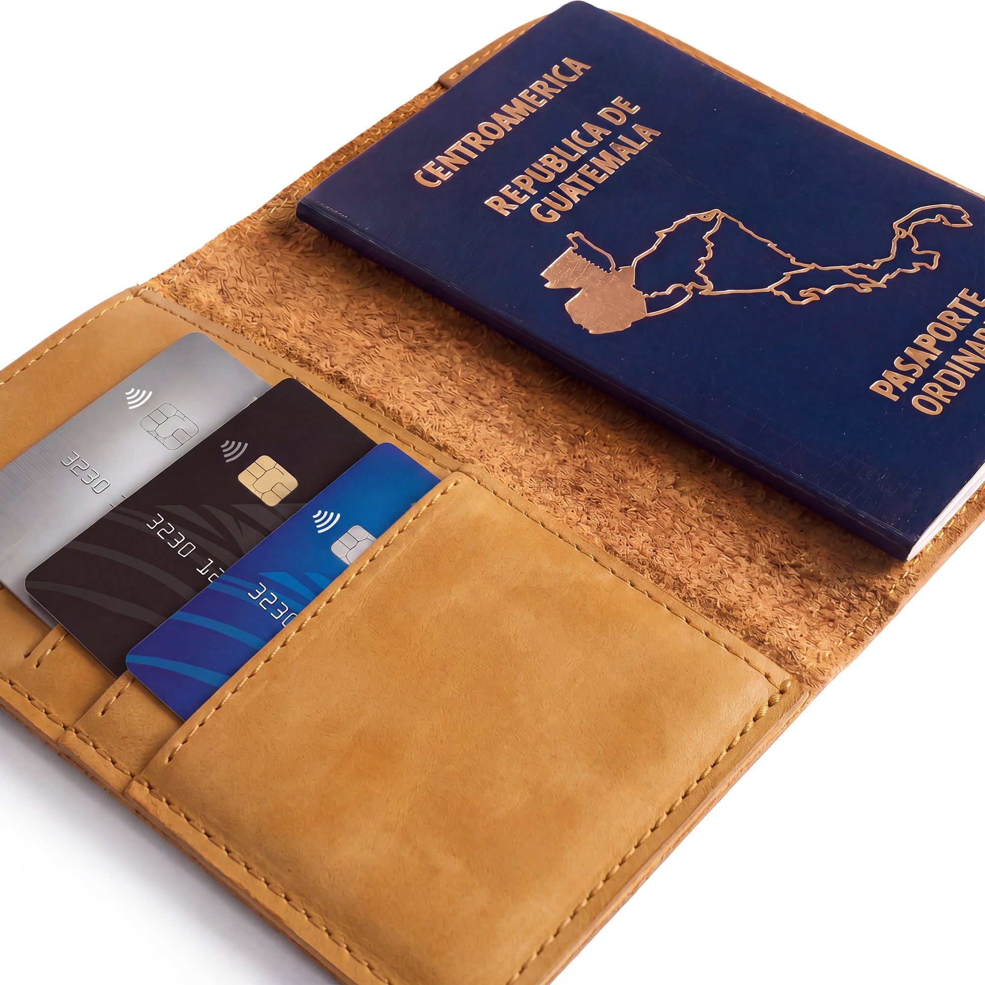Side view of the Hide & Drink Travel Wallet revealing its craftsmanship. This high-quality travel wallet is a bifold passport case beautifully made from full grain leather in La Antigua Guatemala