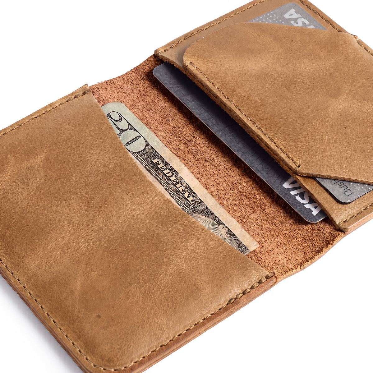 Brown Bi-Fold Card Wallet Diagonal by Hide & Drink, emphasizing its ability to hold several cards and cash securely; a perfect accessory crafted from full grain leather.
