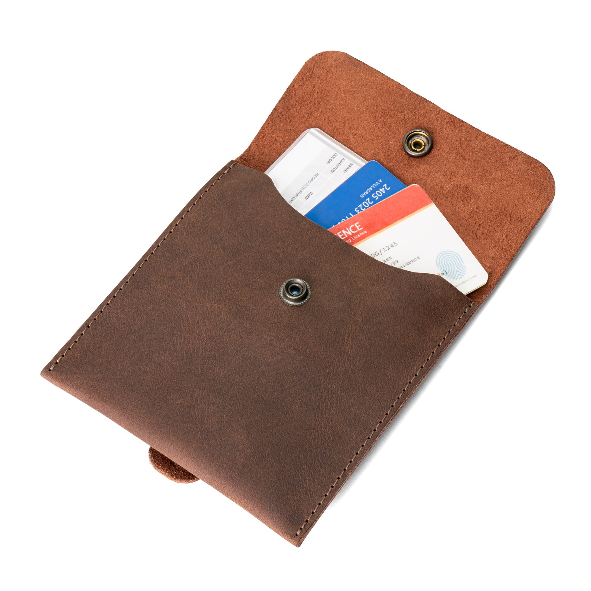 Open view of the Hide & Ride Document Handlebar Bag displaying its spacious interior, made from sturdy full grain leather. This Motorcycle Document Bag is an ideal small bag for handlebar use, perfect for bikers seeking unique accessories handcrafted by artisans in La Antigua Guatemala & Oaxaca Mexico.