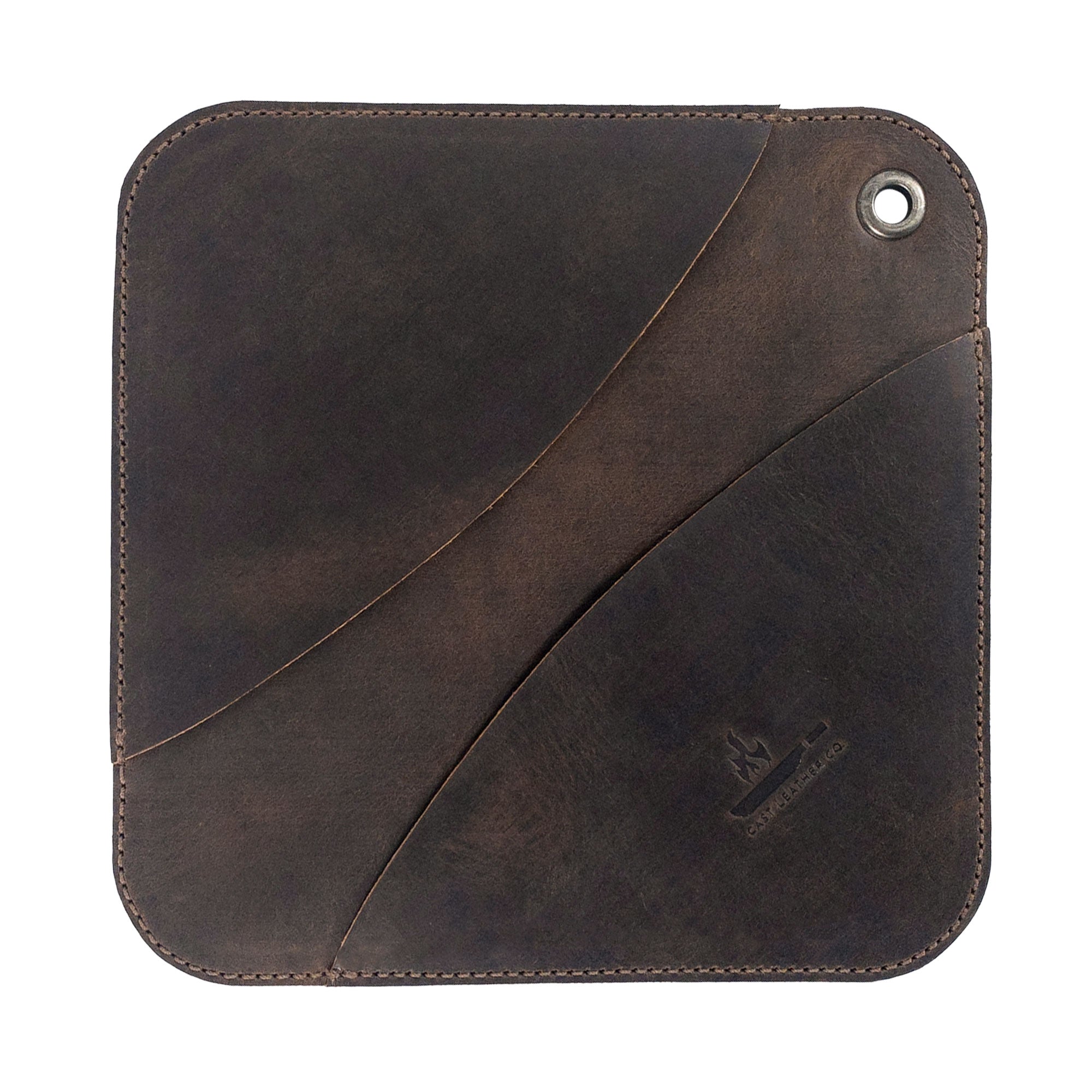 A perfectly crafted Cast Leather Co. Leather Oven Mitt & Trivet, showcasing its minimalist squared design. Made from durable full grain leather, this hot pot pad (potholder) features handmade elements reflecting small batch production and artisanal methods from La Antigua Guatemala.