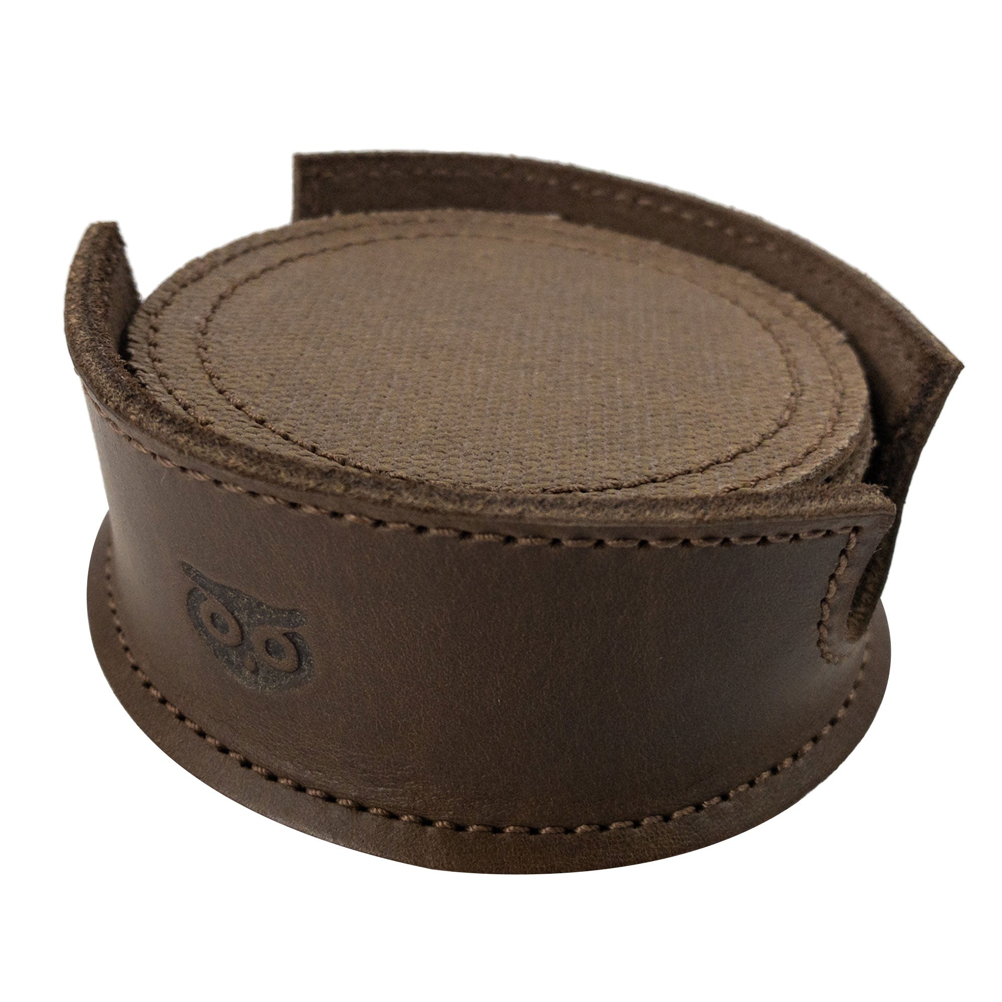 An arrangement showing coasters in their leather holder from the Set of 8 Circular Coasters for Drinks by Hide & Drink. Designed for Glass & Cups Stain Protection, these pieces are made from high-quality Waxed Canvas and Full Grain Leather. Celebrate the StockyardX ethos with these Small Batch Production coasters that are Hand Cut, Hand Sewn, Fire Branded, and made Artisan, Handmade in La Antigua Guatemala & Oaxaca Mexico.