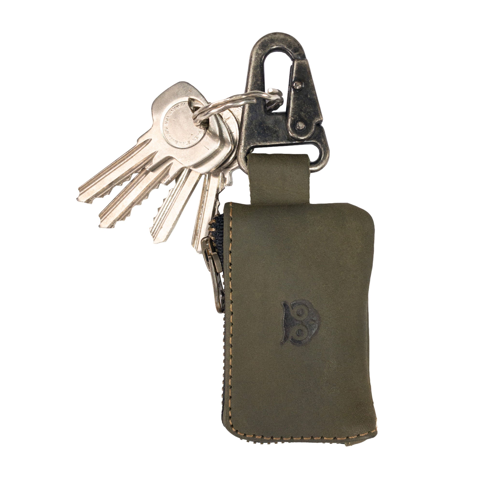 Close-up of Hide & Drink Car Key Holder showcasing its leather texture, holding keys and cash, emphasizing its function as a zipper case for charging cables and flash drives secured by a Nickel Metal Clasp. StockyardX, Small Batch Production, Hand Cut, Hand Sewn, Fire Branded, Artisan, Handmade in La Antigua Guatemala & Oaxaca Mexico.