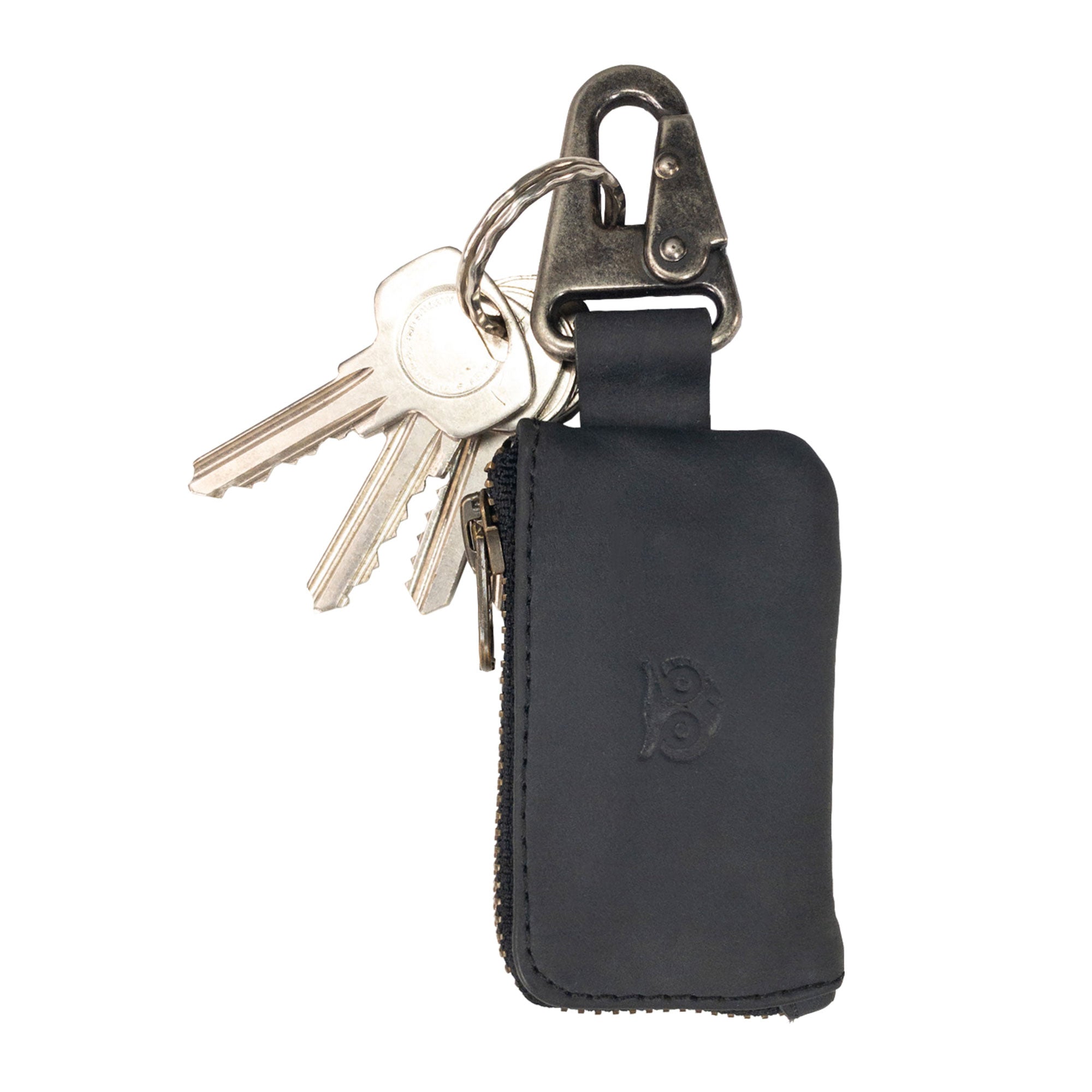 Close-up view of the Car Key Holder by Hide & Drink, illustrating the use of high-quality materials in its design. This Car Key Holder provides a convenient cash zipper case perfect for securing items like headphone and charging cables, memory cards, and flash drives with a nickel metal clasp. Celebrating artisan craftsmanship, it showcases small batch production, hand cut, hand sewn excellence, handmade in La Antigua Guatemala & Oaxaca Mexico.
