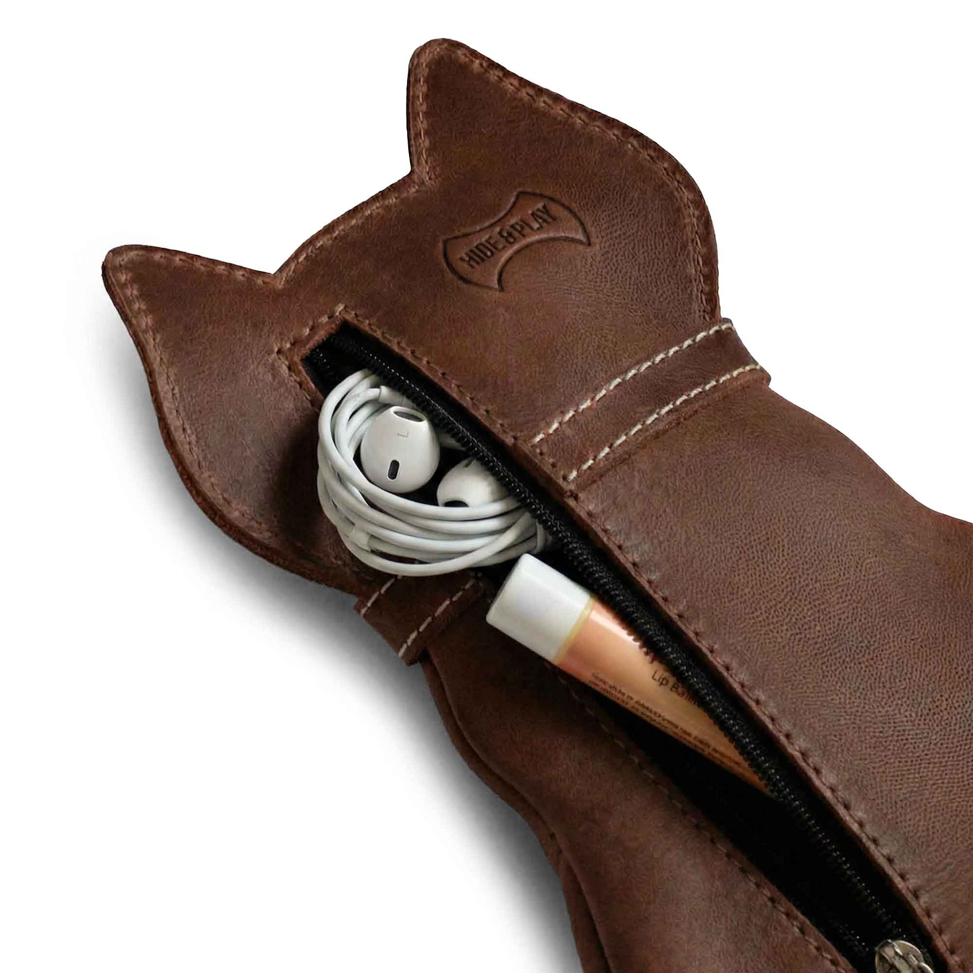 Interior view of the Hide & Play Kitty Pouch showing it holding earphones and makeup items. This practical Zippered Cash Holder Wallet for Coins is a Must-Have tiny case for everyday essentials, combining style and utility as a Small Coin Pouch.