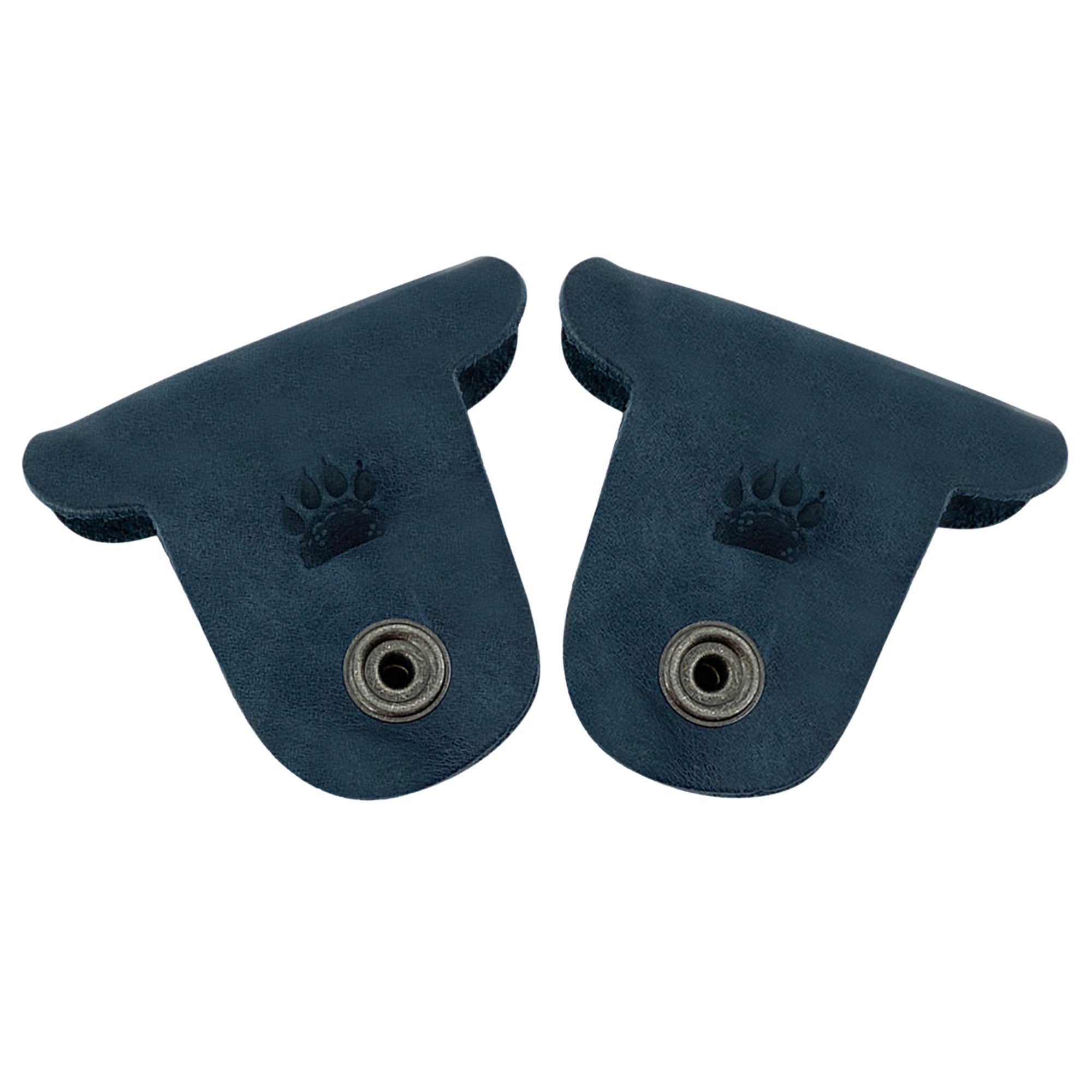 Taco Dog's navy blue Dog Cord Keepers are ideal for keeping your cords tidy and organized. Designed from full grain leather, these handmade accessories feature clips for easy organization of headphones and chargers during travel. Enjoy artisanal quality from La Antigua Guatemala with this unique 2 pack.