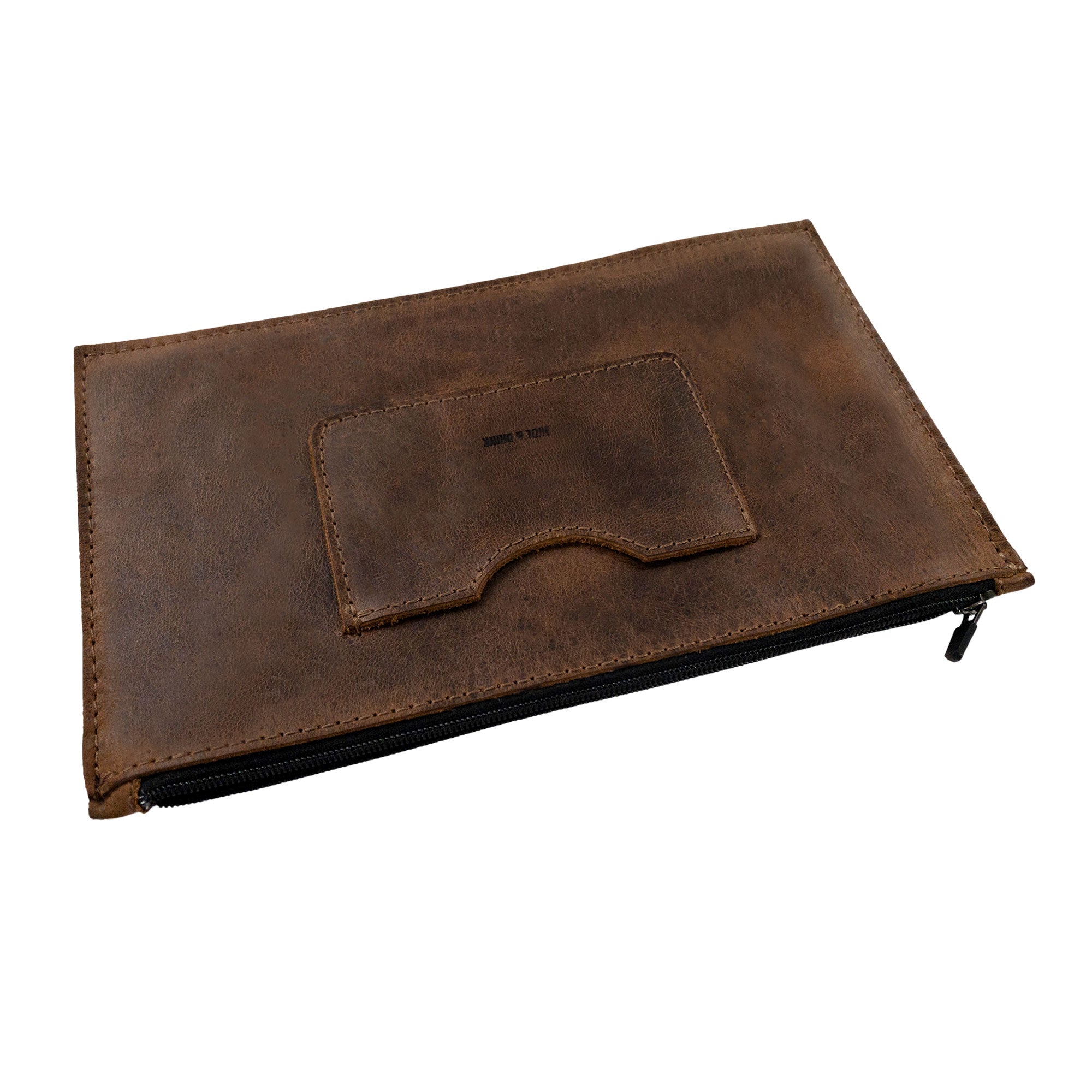 A side view of a brown rectangular zippered handbag by Hide & Drink, displaying its sleek design. This female purse features a practical card slot and is made from high-quality full grain leather, showcasing small batch production techniques that are hand cut and sewn by artisans in La Antigua Guatemala & Oaxaca Mexico.