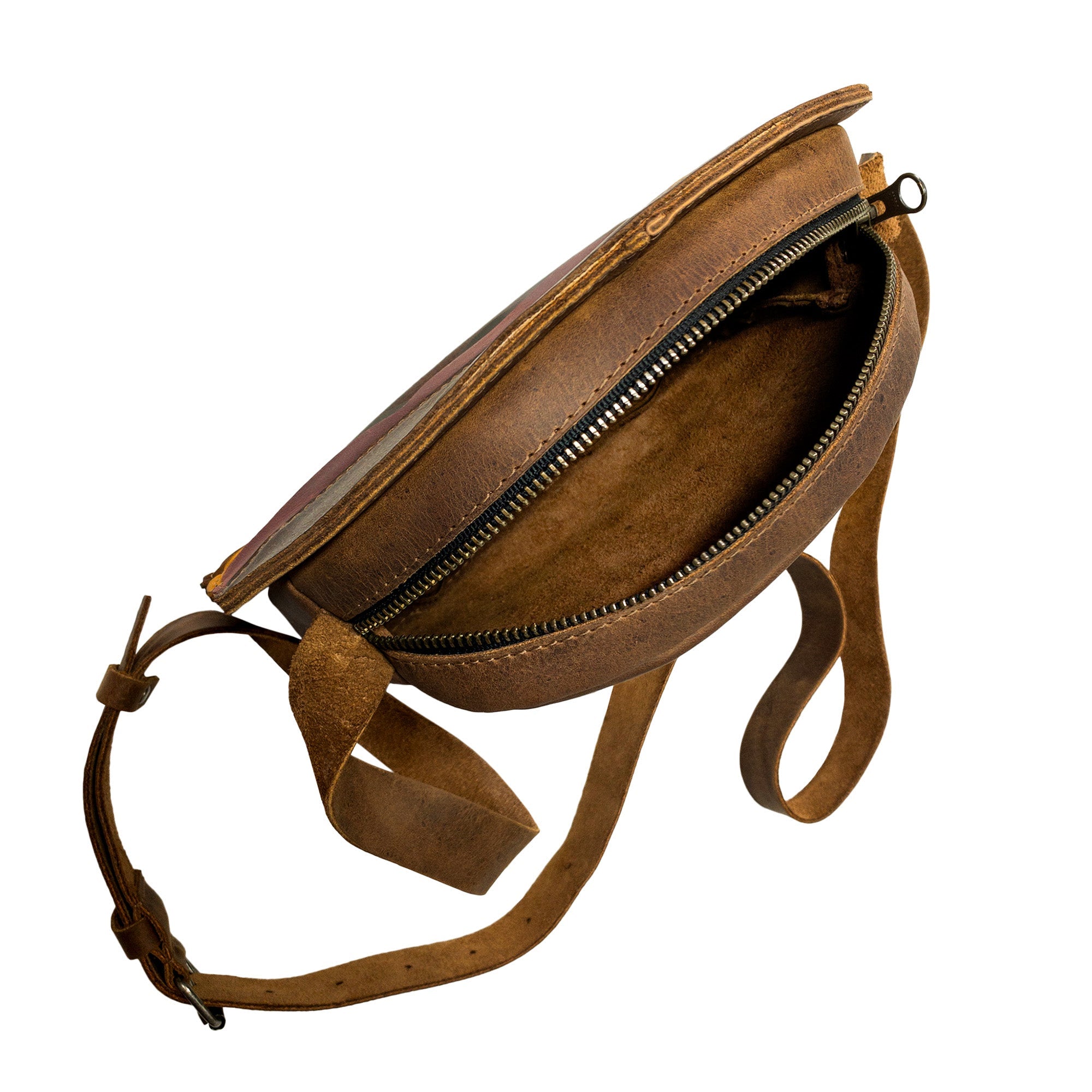 Interior view of the Burger-Shaped Shoulder Bag from Tudi Frudi, highlighting its zipper closure and spacious design. This eye-catching Full Grain Leather bag is designed for everyday convenience as a Crossbody Bag or Messenger Bag. Handmade in La Antigua Guatemala & Oaxaca Mexico, it's a great travel accessory crafted in small batches.
