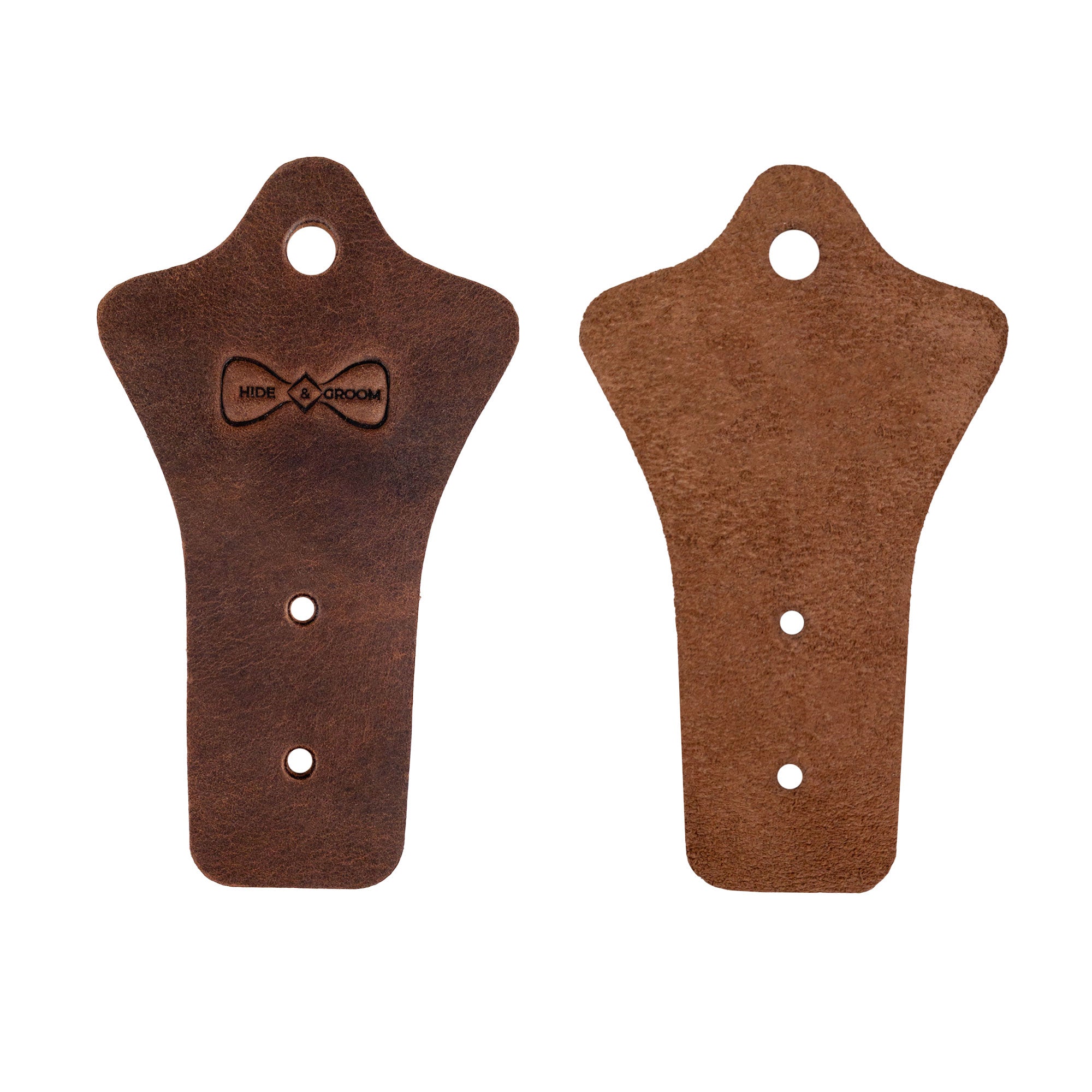 Hide & Groom Set of 2 Buckle Belt Hangers displayed separately, showcasing their beautiful full grain leather craftsmanship. These hangers are perfect for closet or wall mount storage and make memorable gifts for groomsmen. Handmade in La Antigua Guatemala, featuring artisan techniques that reflect quality and dedication.