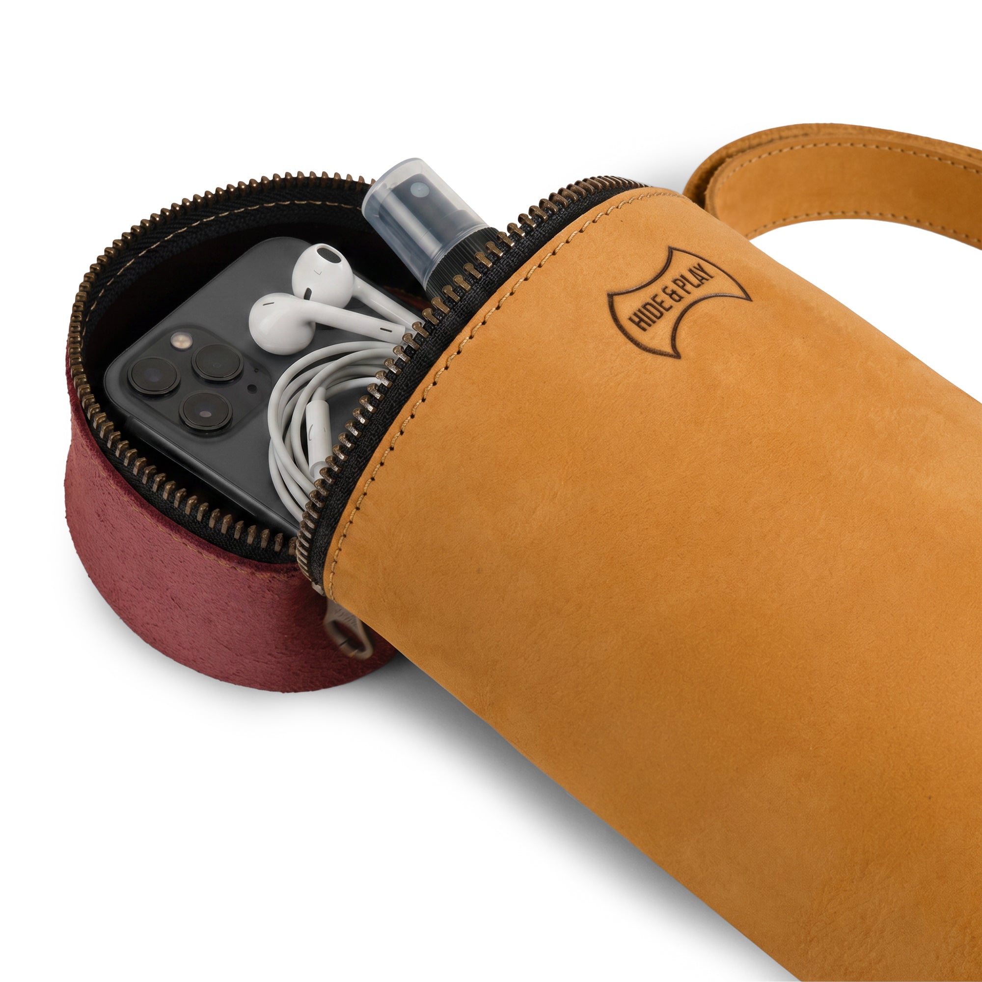 Inside view of the Pencil-Shaped Crossbody Bag by Hide & Play, displaying its spacious interior for essentials. This versatile Leather Pencil-Shaped Crossbody Bag, ideal as a messenger bag or travel backpack, is handmade from quality leather with a unique artisan touch.