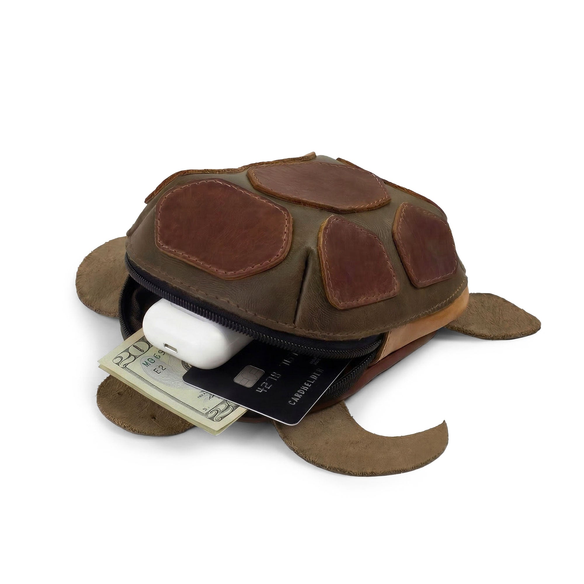 Hide & Play Leather Turtle Pouch open layout with cards and earbuds inside the hand cut and hand sewn full grain leather turtle-shaped coin pouch, a tortoise-shaped leather coin purse change bag and zippered cable case for a small charger cable holder—purses & pouches for cash as a tiny travel carrier; small batch production, fire branded artisan handmade in La Antigua Guatemala & Oaxaca Mexico (StockyardX).