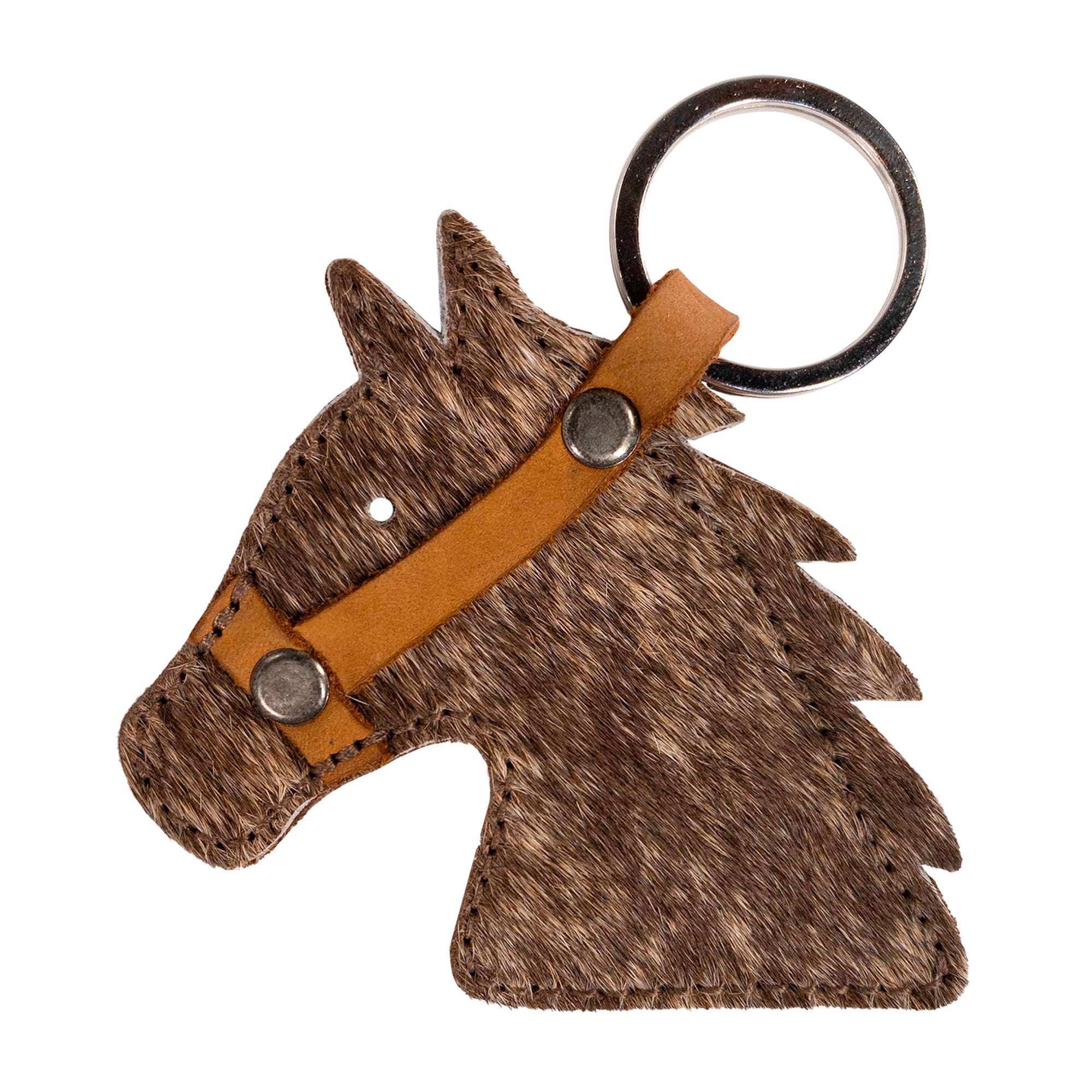 Close-up of the Cowboy Stallion Head Keychain by Western Leather Works, highlighting the unique hair-on-hide texture. This handmade accessory embodies artisan craftsmanship, combining Full Grain Leather with fire branding, truly a piece from La Antigua Guatemala & Oaxaca Mexico.