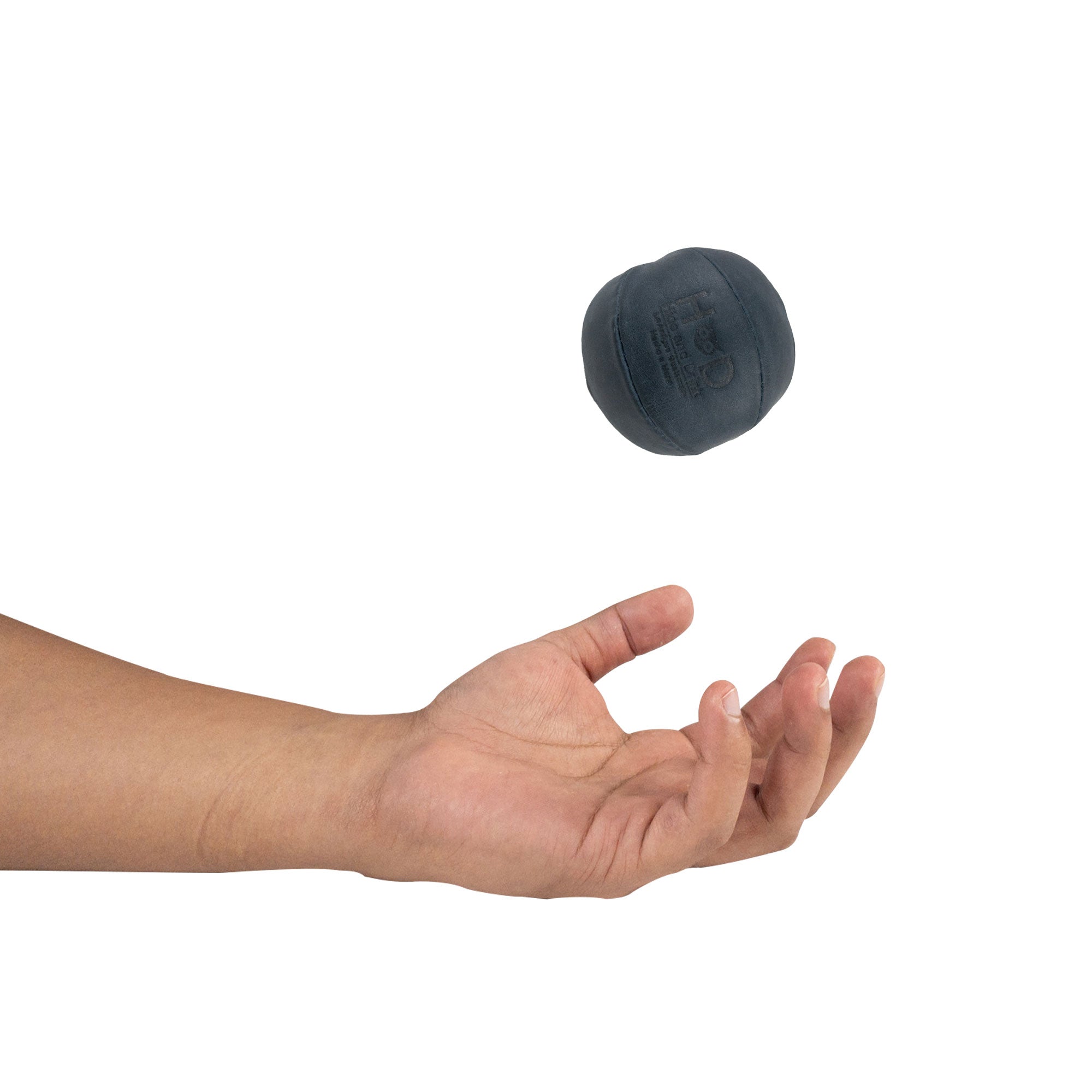 Hide & Drink navy Stress Ball caught mid-throw, designed to relieve fidgeting and anxiety. This squishy tension accessory features classic styling and is artisan crafted from full grain leather made in La Antigua Guatemala.